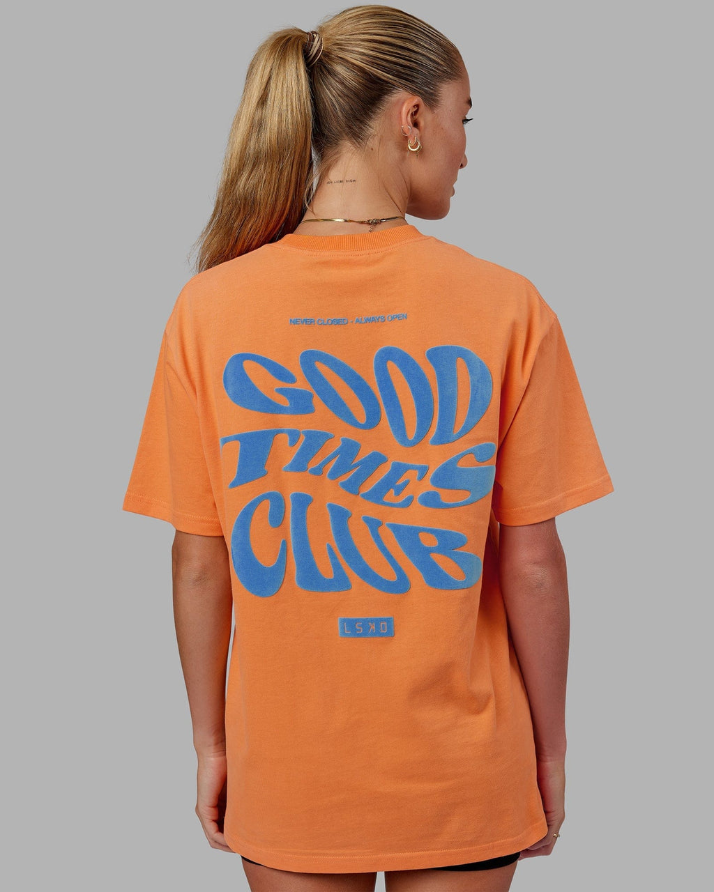 Model wearing Unisex Good Times Heavyweight Tee Oversize - Tangerine-Blue