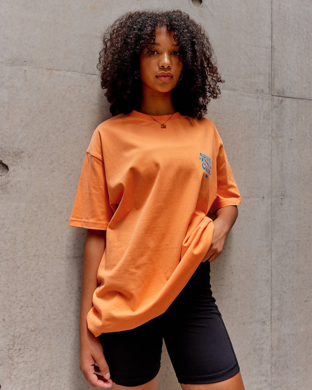 Model wearing Unisex Good Times Heavyweight Tee Oversize - Tangerine-Blue
