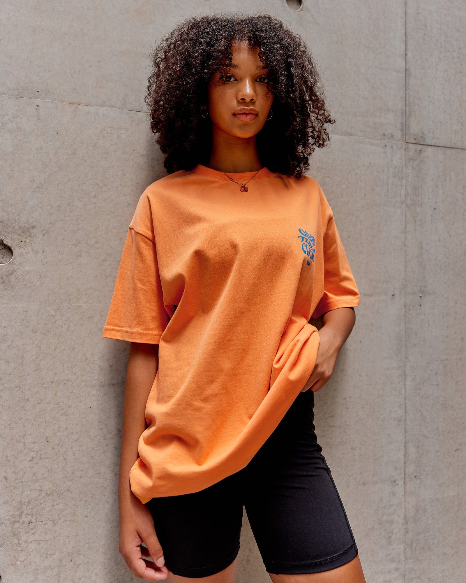 Model wearing Unisex Good Times Heavyweight Tee Oversize - Tangerine-Blue