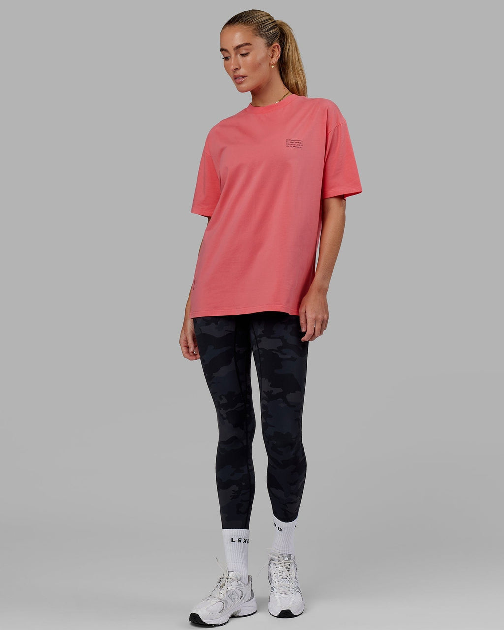 Model wearing Unisex Strive FLXCotton Tee Oversize - Sunkist Coral