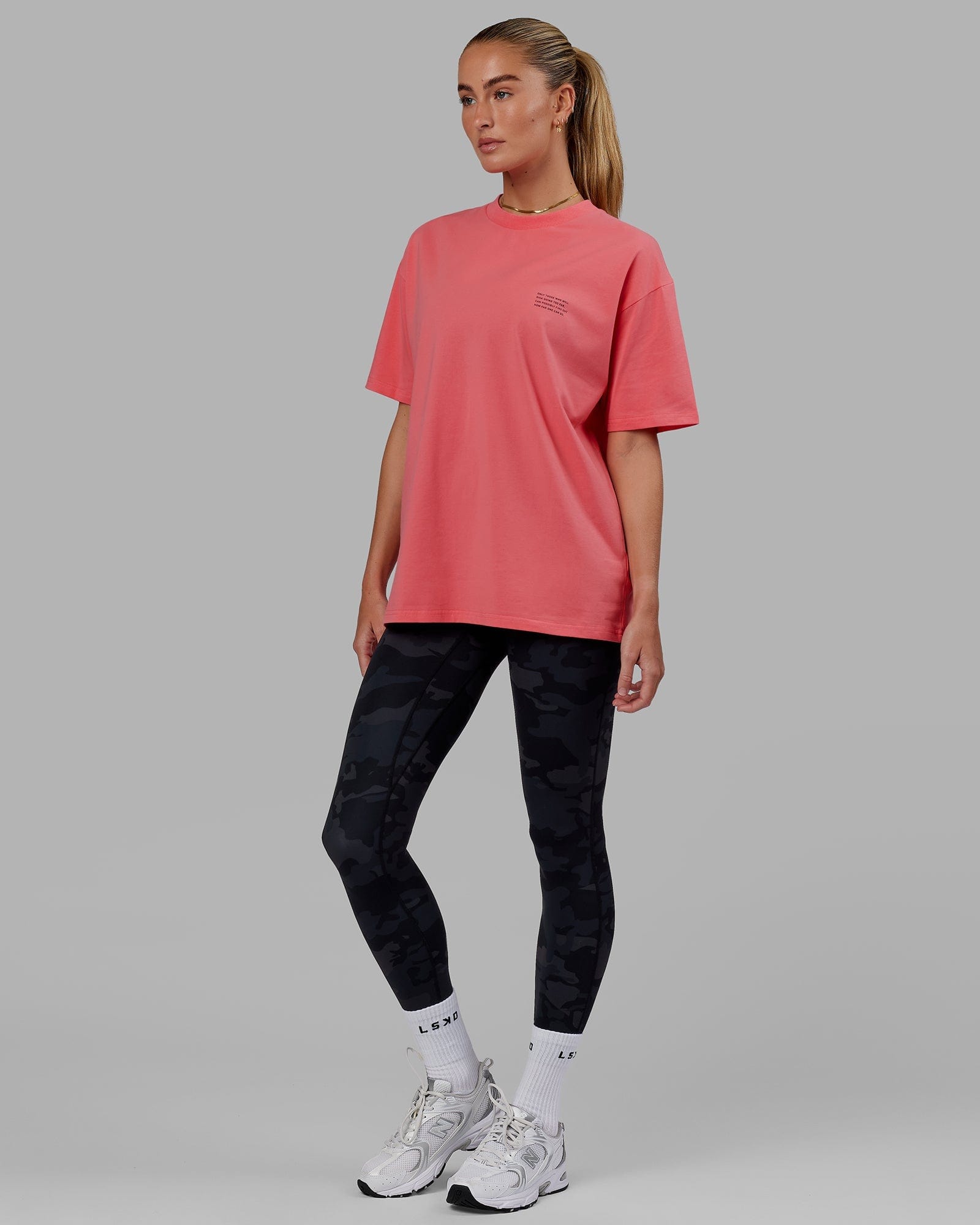 Model wearing Unisex Strive FLXCotton Tee Oversize - Sunkist Coral