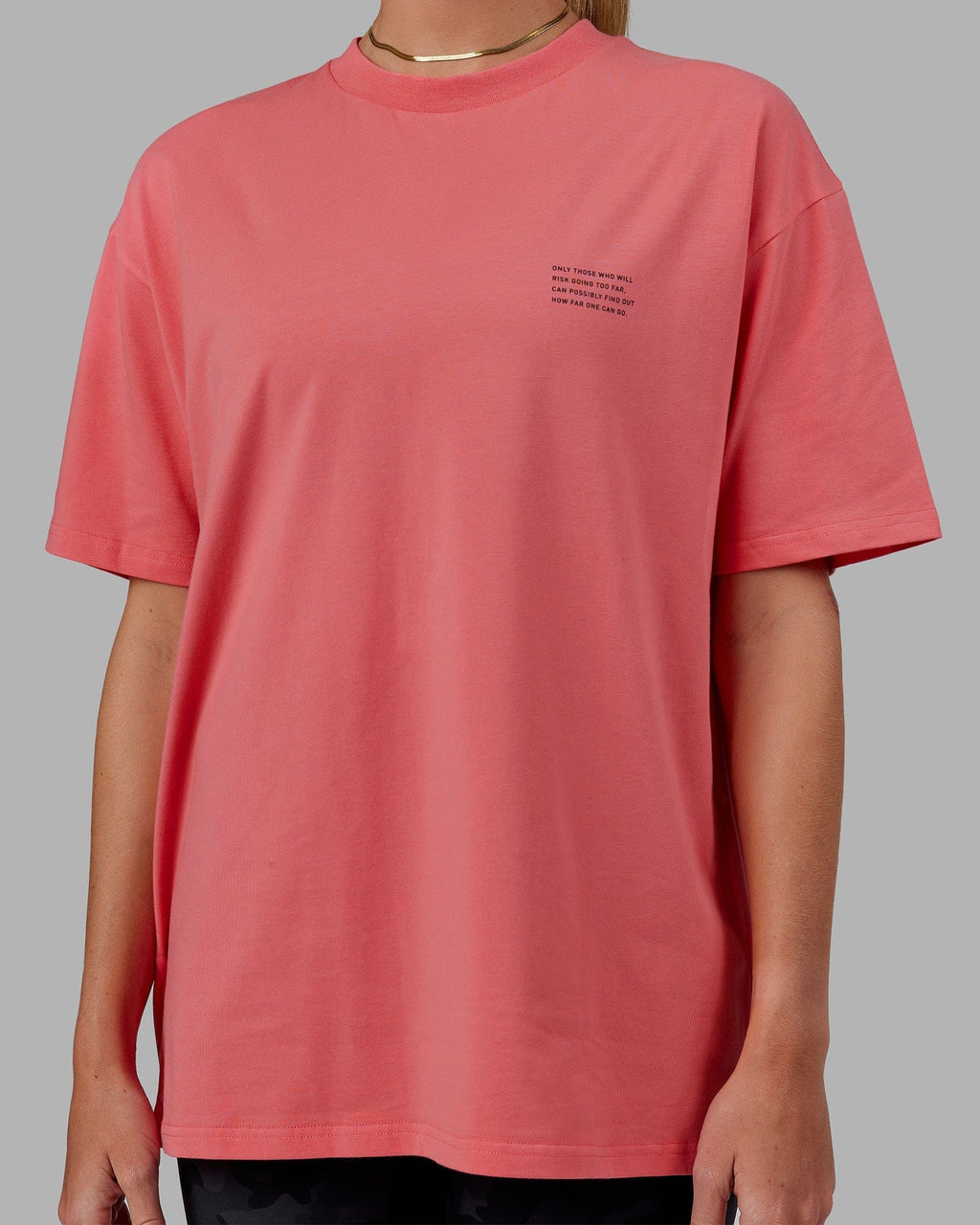 Model wearing Unisex Strive FLXCotton Tee Oversize - Sunkist Coral