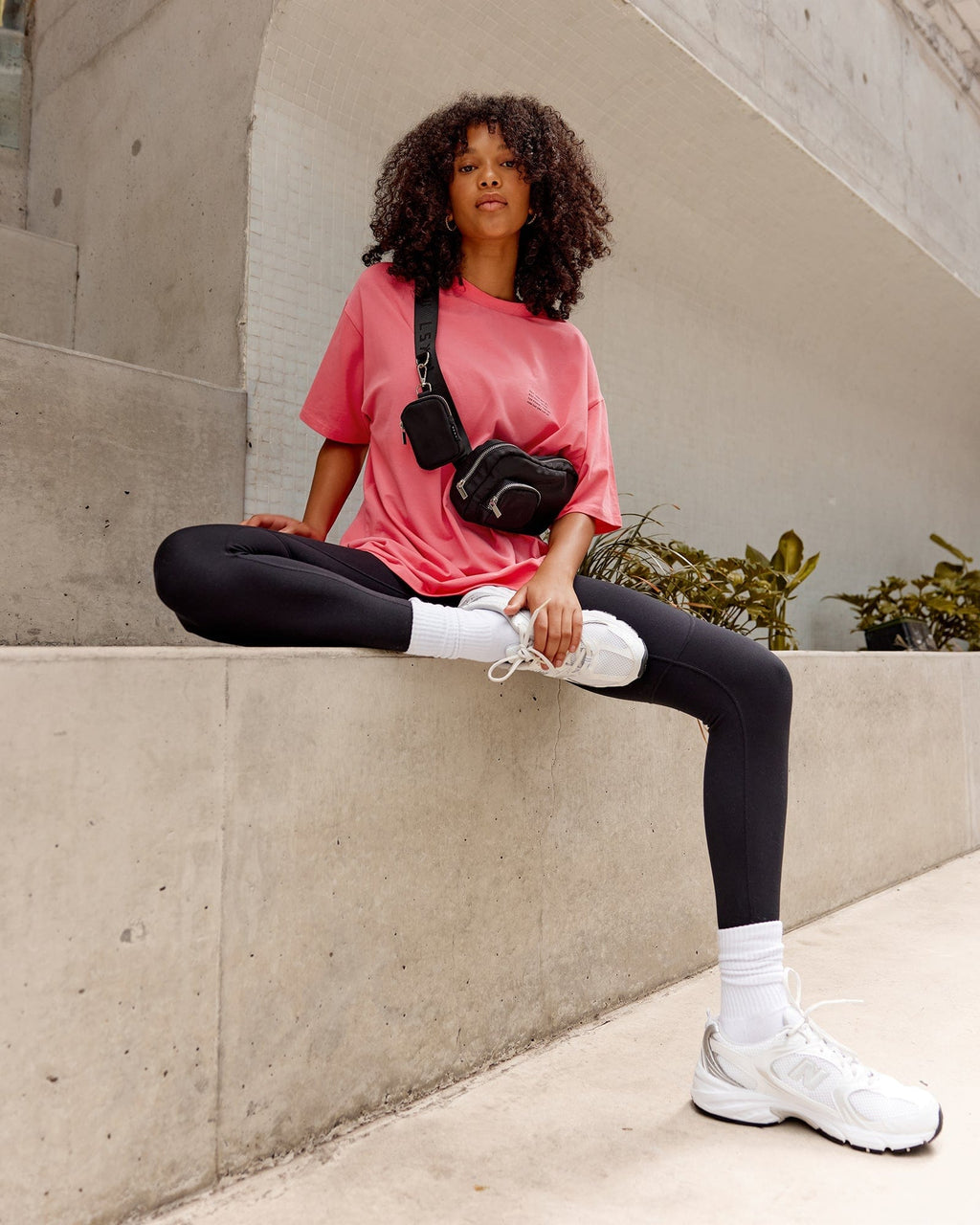 Model wearing Unisex Strive FLXCotton Tee Oversize - Sunkist Coral