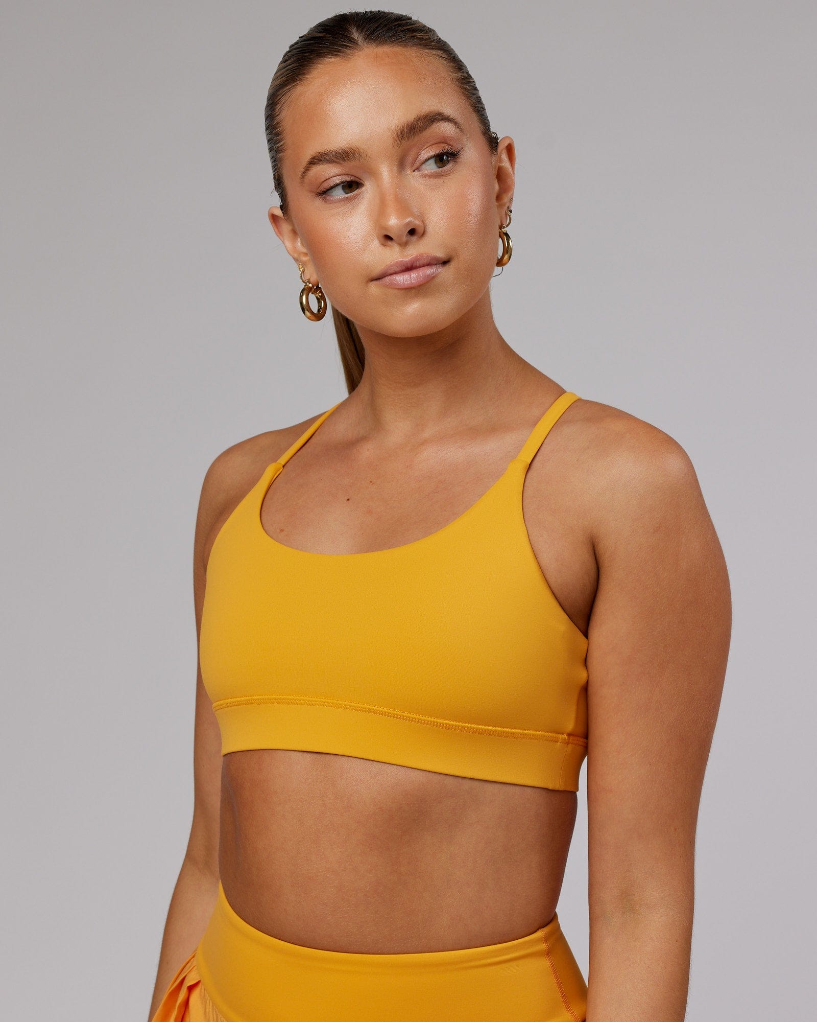 Model wearing Advantage Sports Bra - Butterscotch