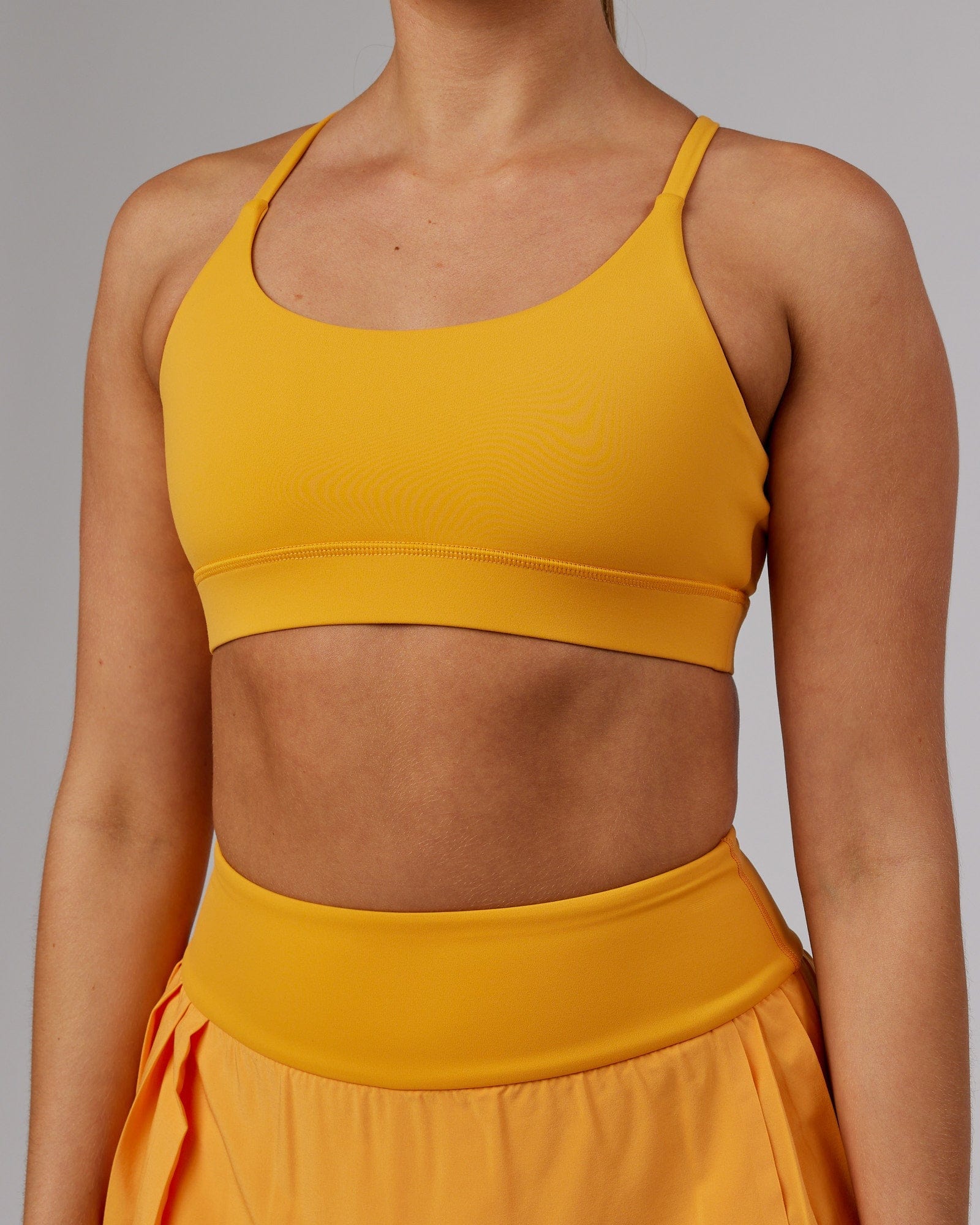 Model wearing Advantage Sports Bra - Butterscotch