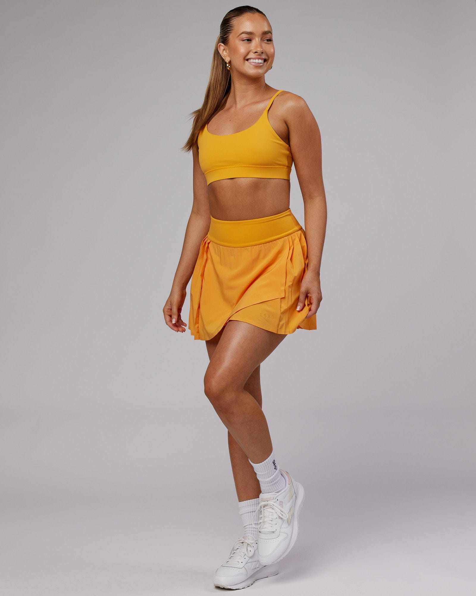 Model wearing Advantage Sports Bra - Butterscotch