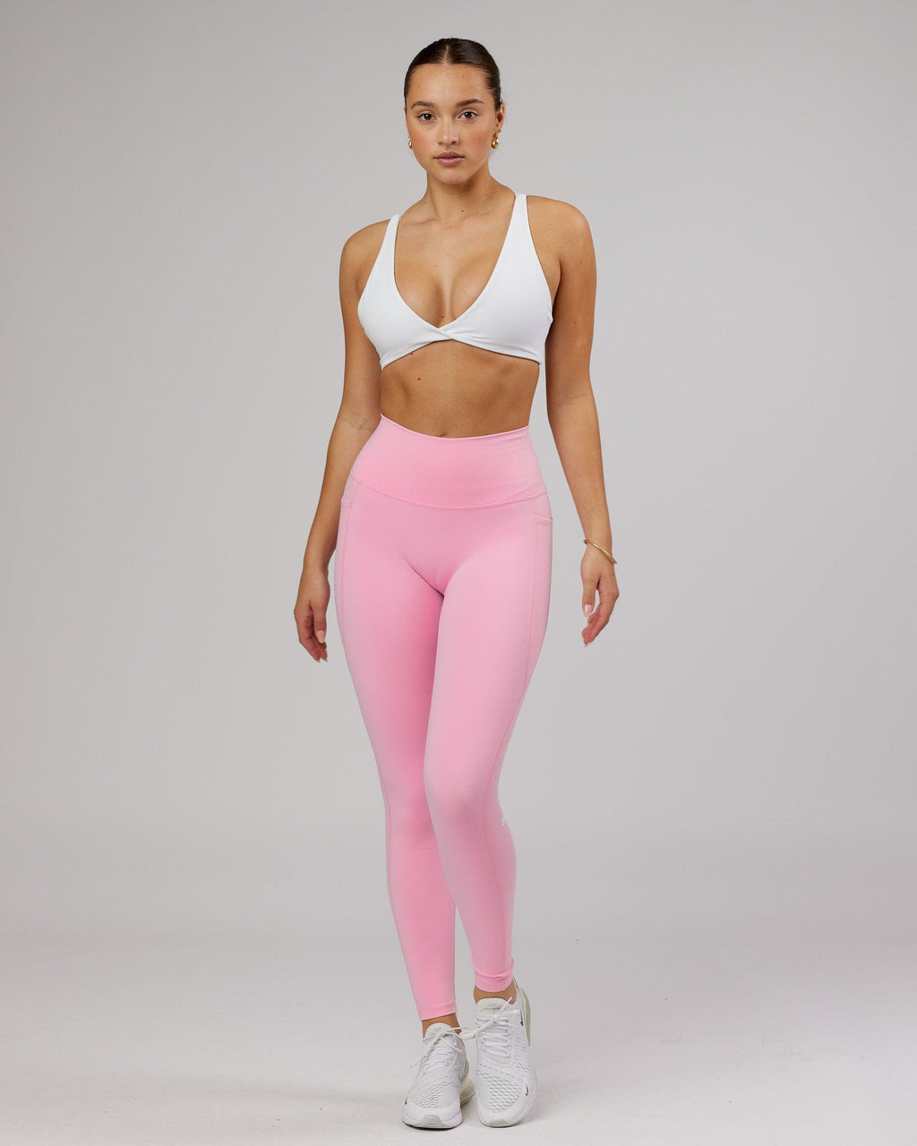 Model wearing Agile Sports Bra - White-Flamingo