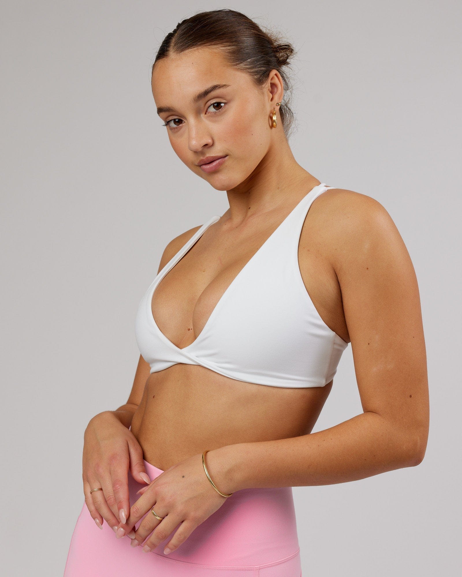 Model wearing Agile Sports Bra - White-Flamingo