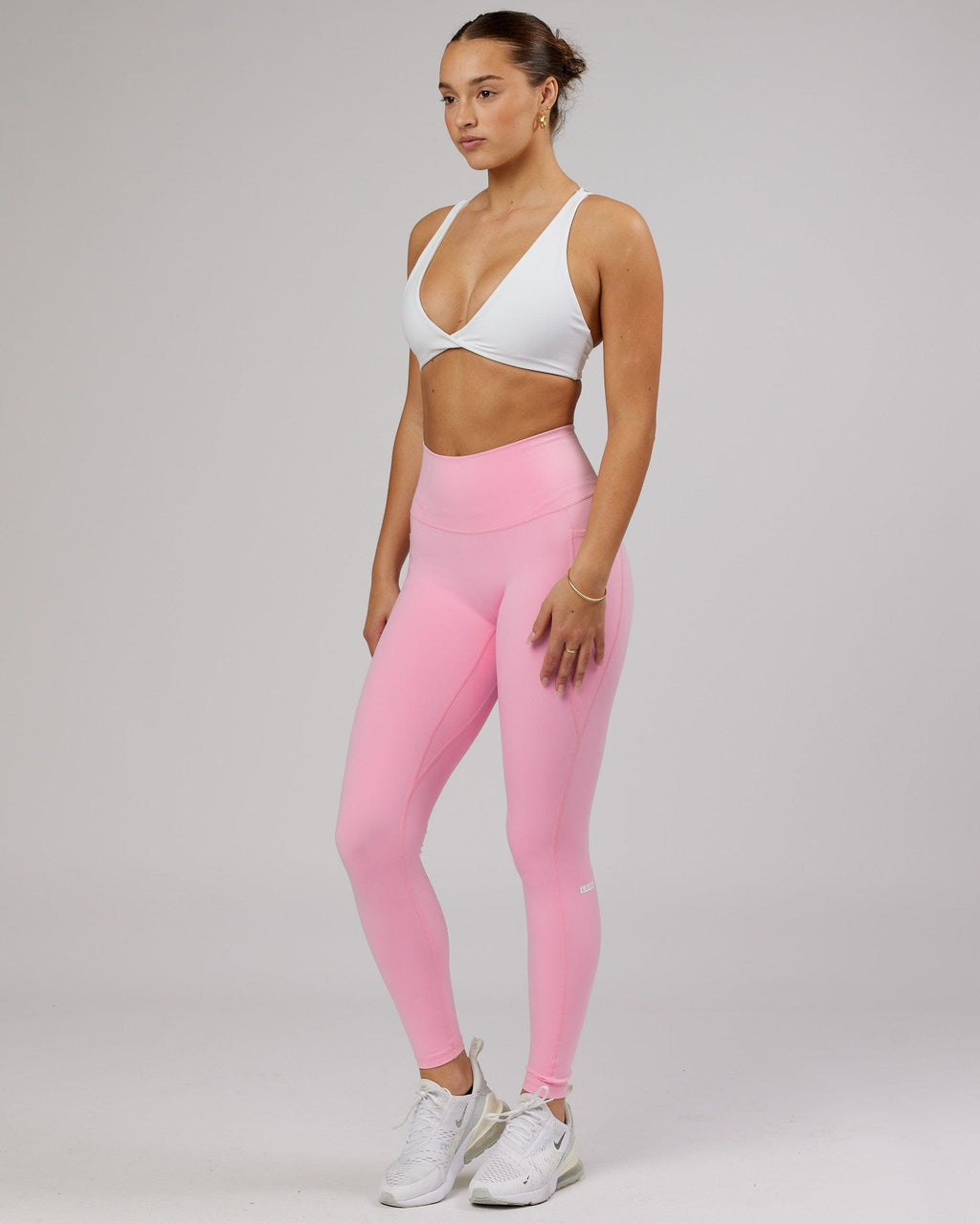 Model wearing Agile Sports Bra - White-Flamingo