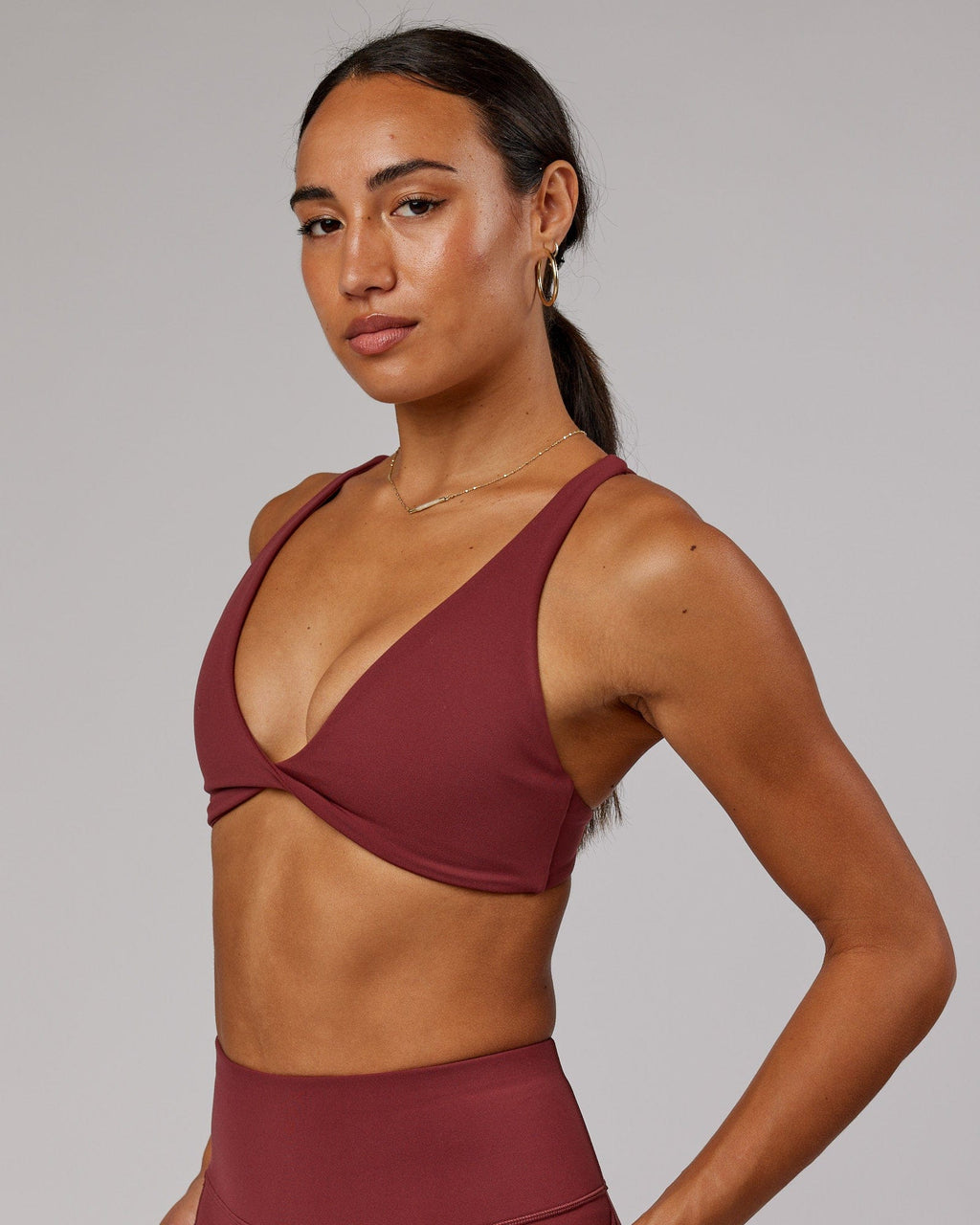 Model wearing Agile Sports Bra - Apple Berry