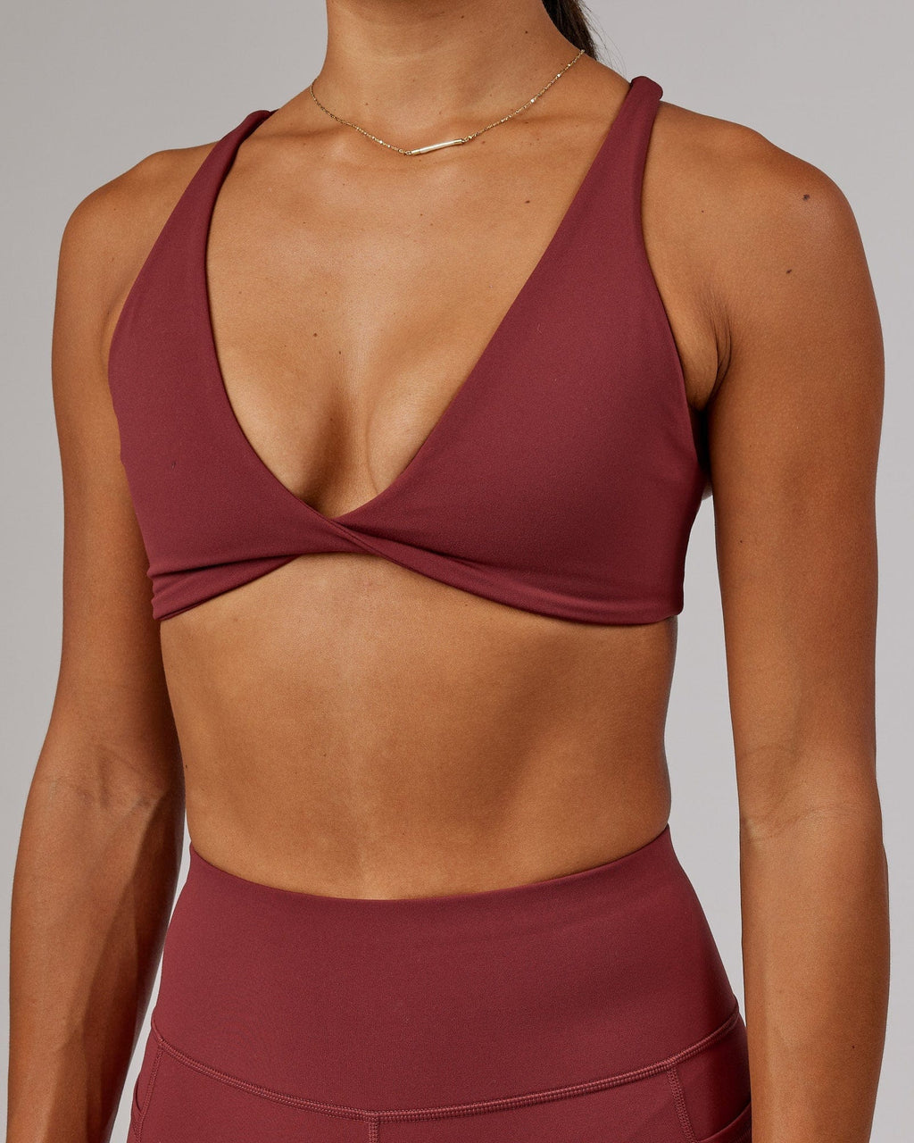 Model wearing Agile Sports Bra - Apple Berry