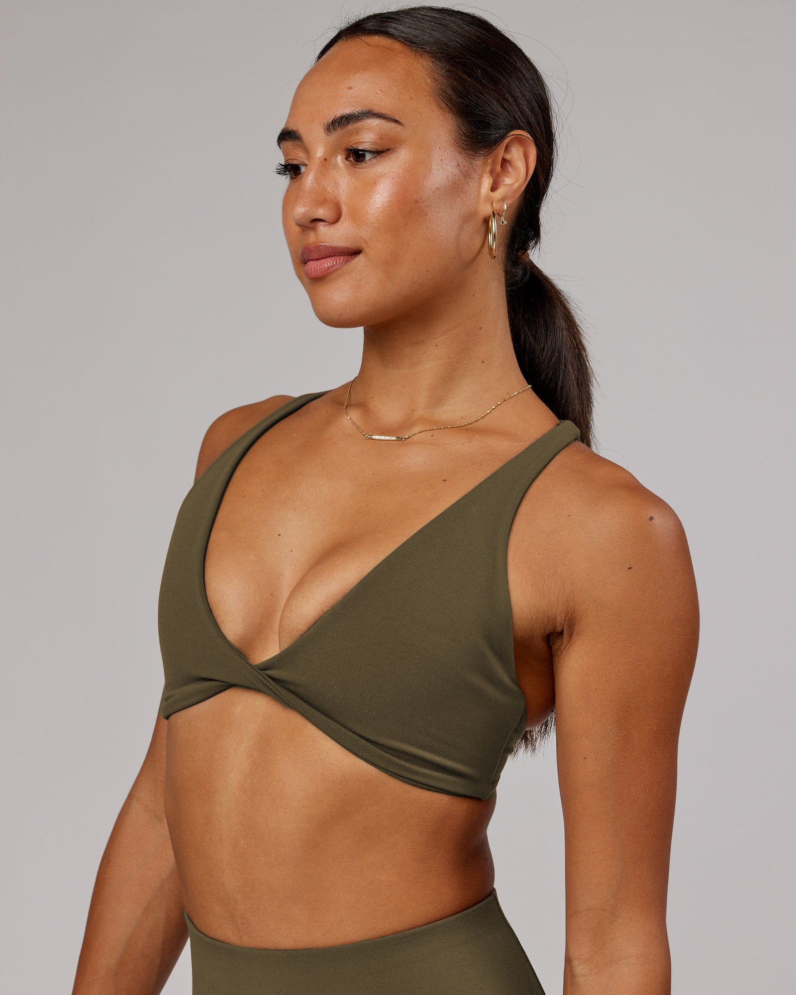 Model wearing Agile Sports Bra - Army Green