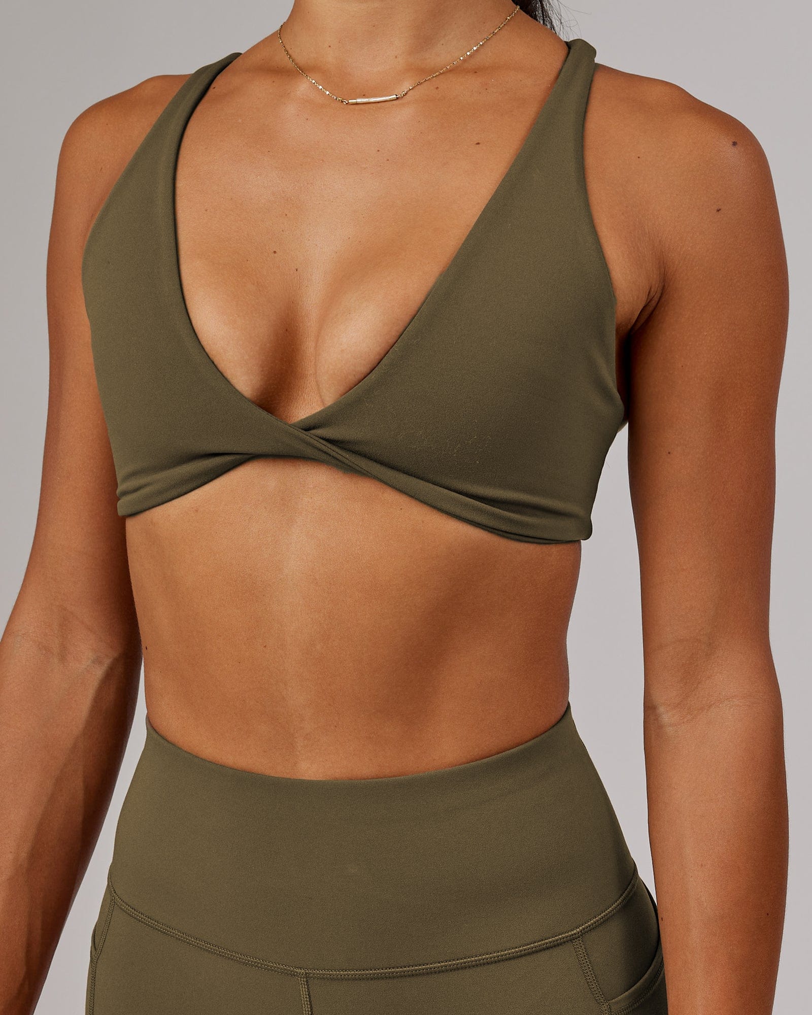 Model wearing Agile Sports Bra - Army Green