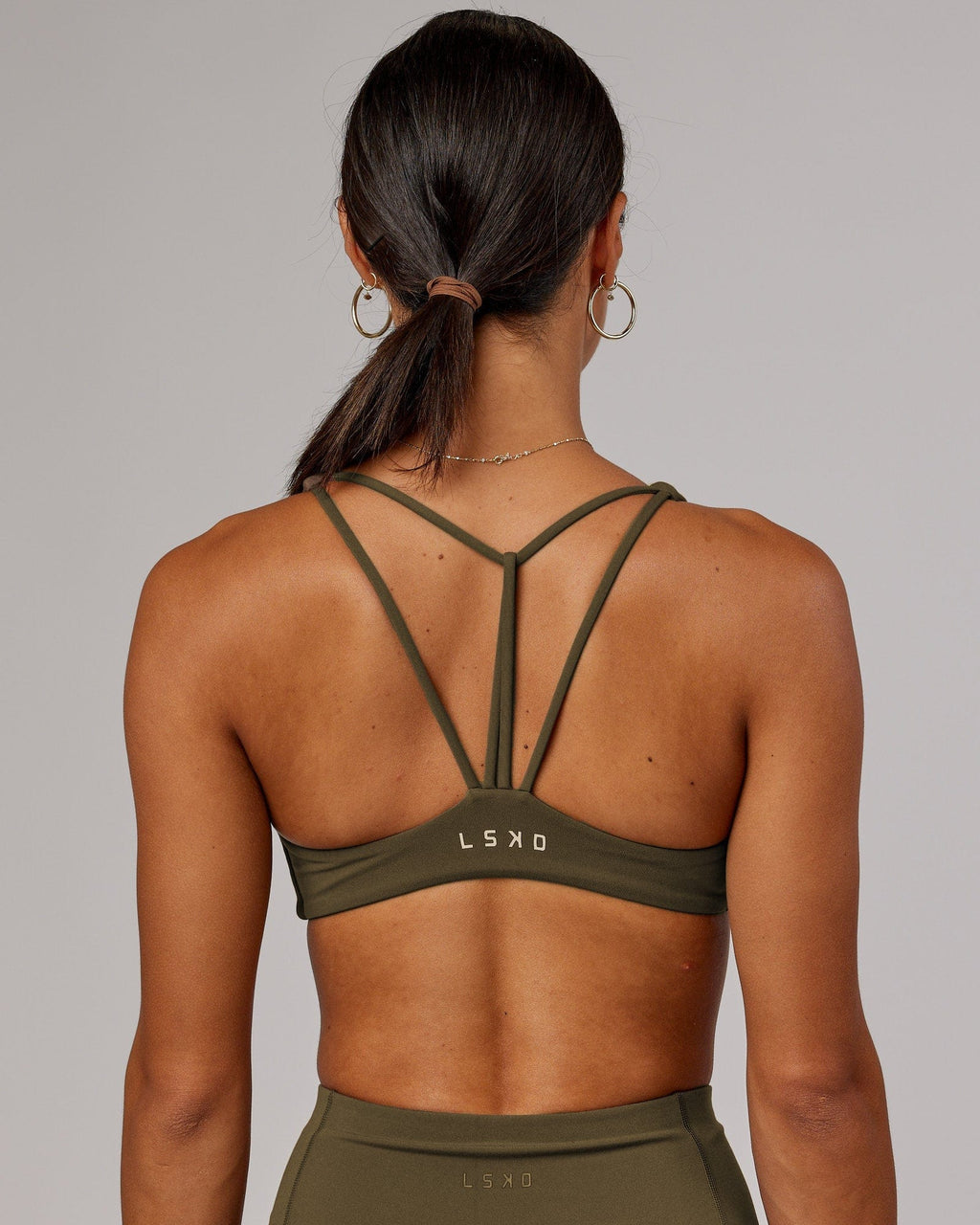 Model wearing Agile Sports Bra - Army Green