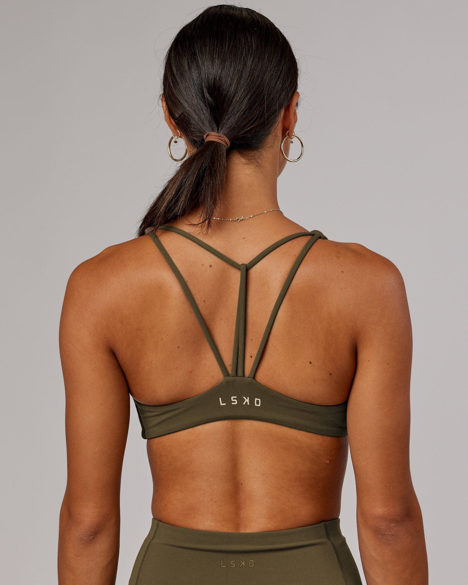 Model wearing Agile Sports Bra - Army Green