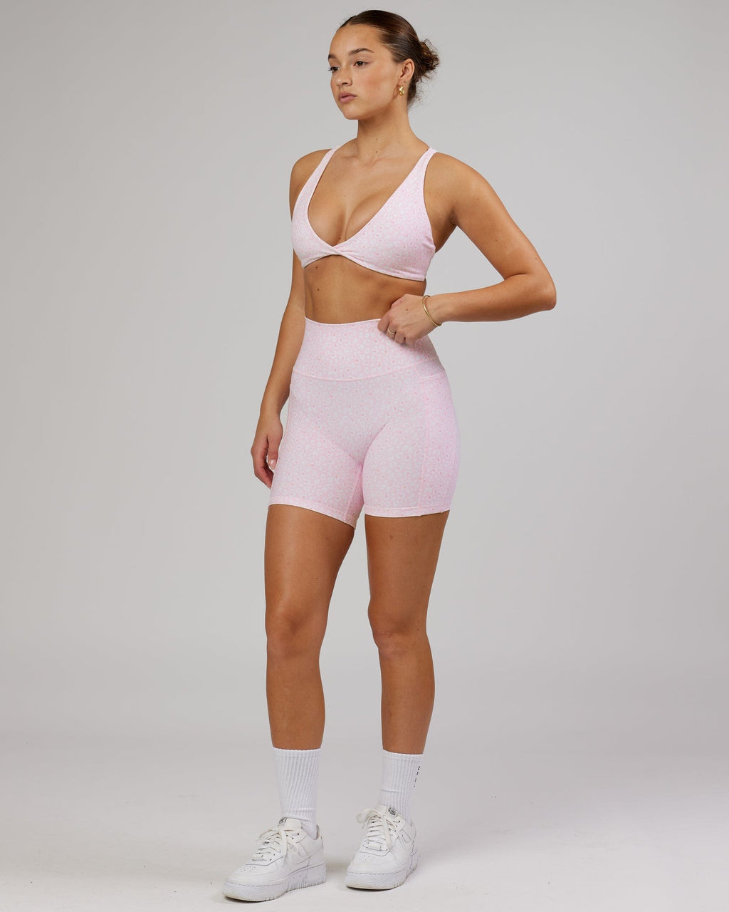 Model wearing Agile Sports Bra - Blush Leopard