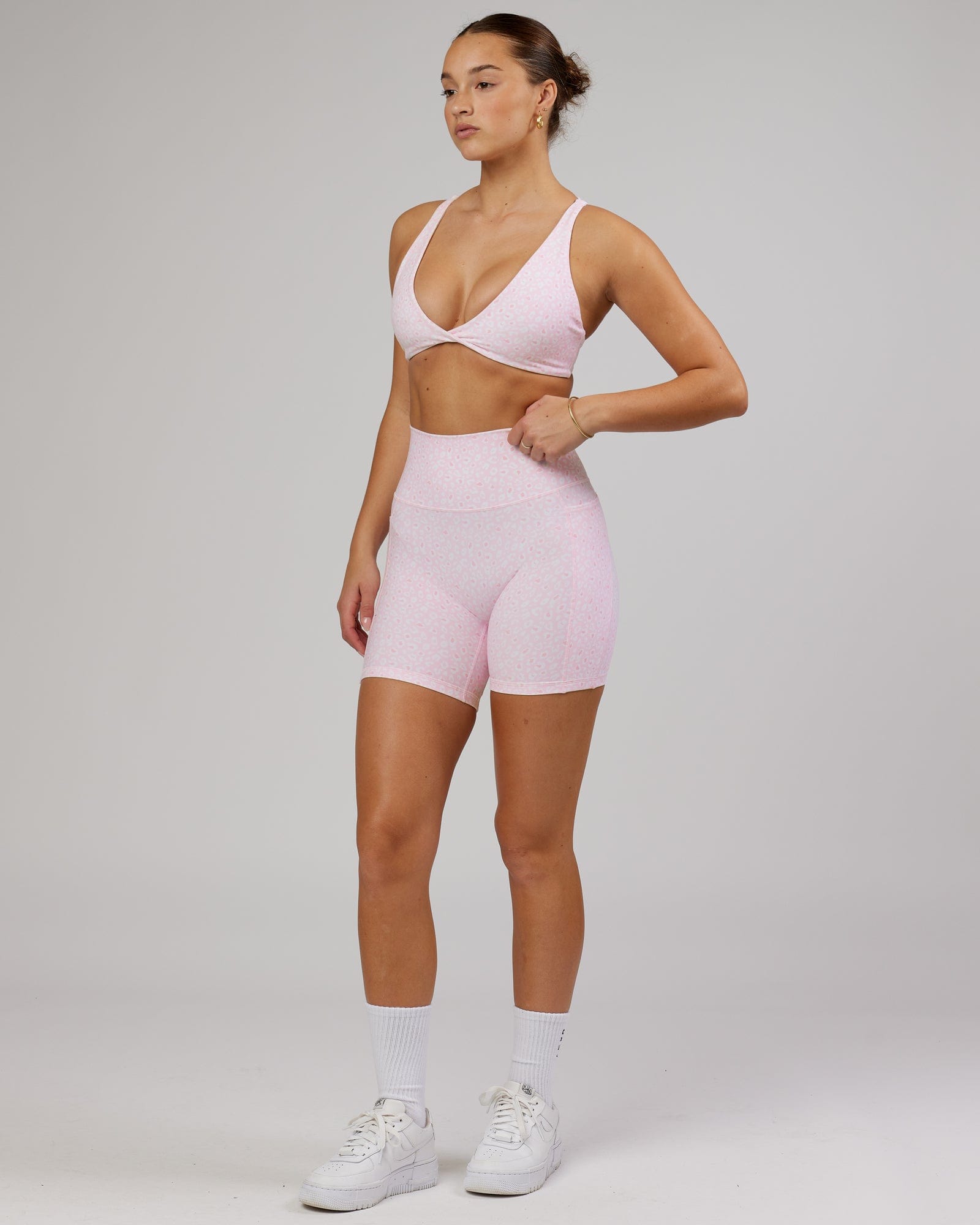 Model wearing Agile Sports Bra - Blush Leopard