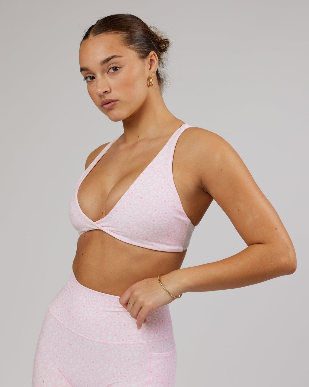 Model wearing Agile Sports Bra - Blush Leopard