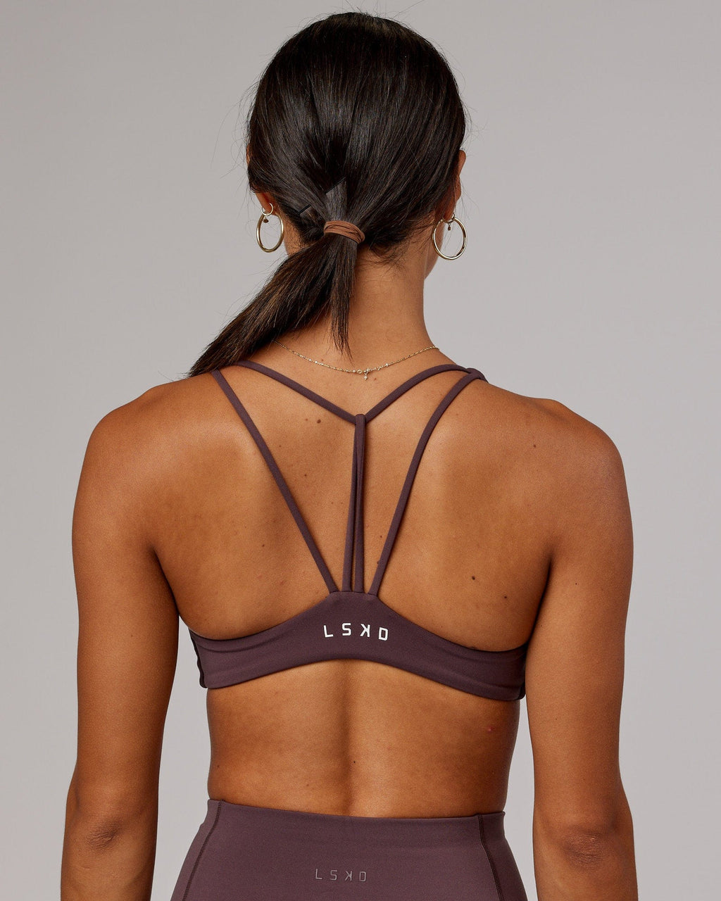 Model wearing Agile Sports Bra - Plum