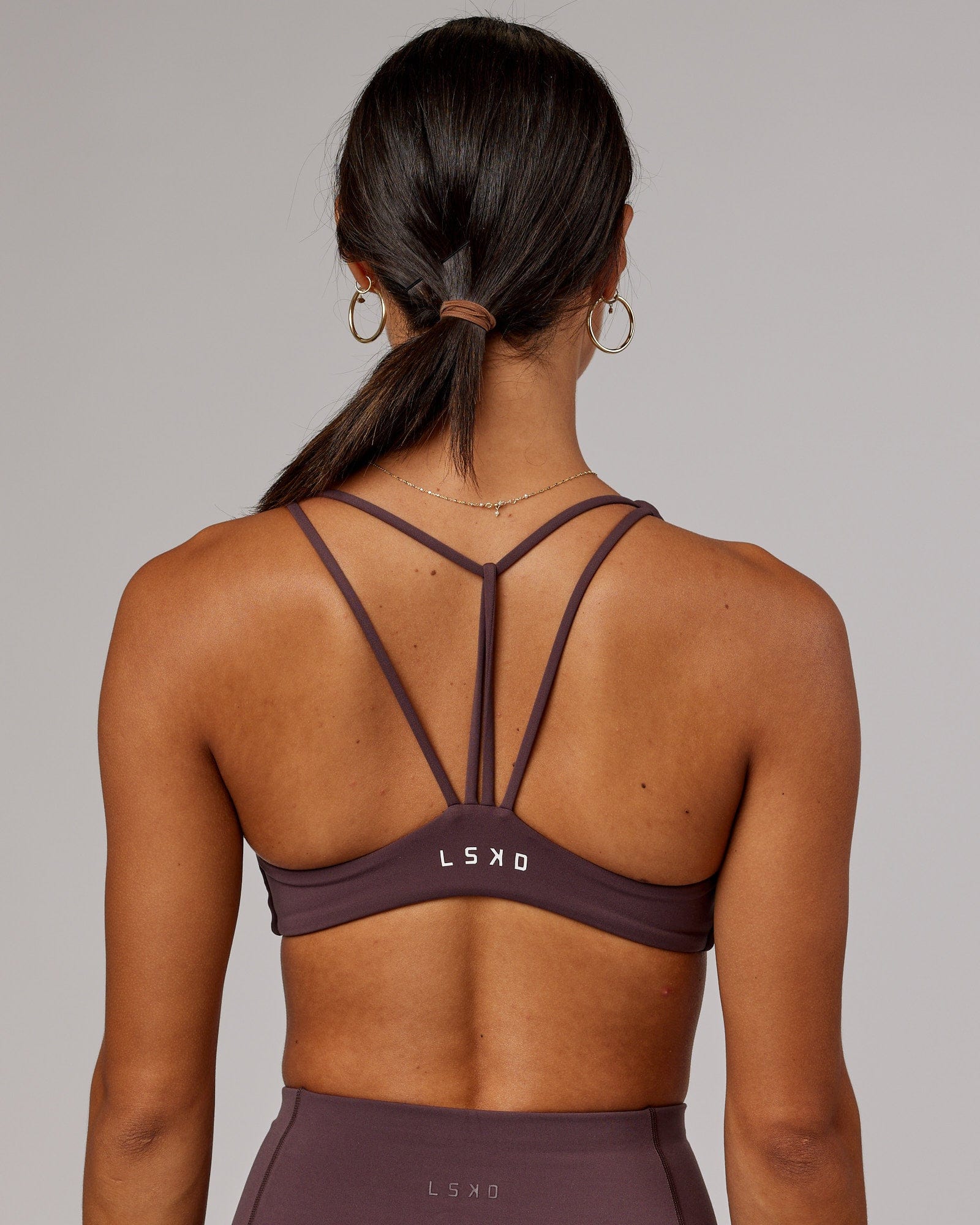 Model wearing Agile Sports Bra - Plum