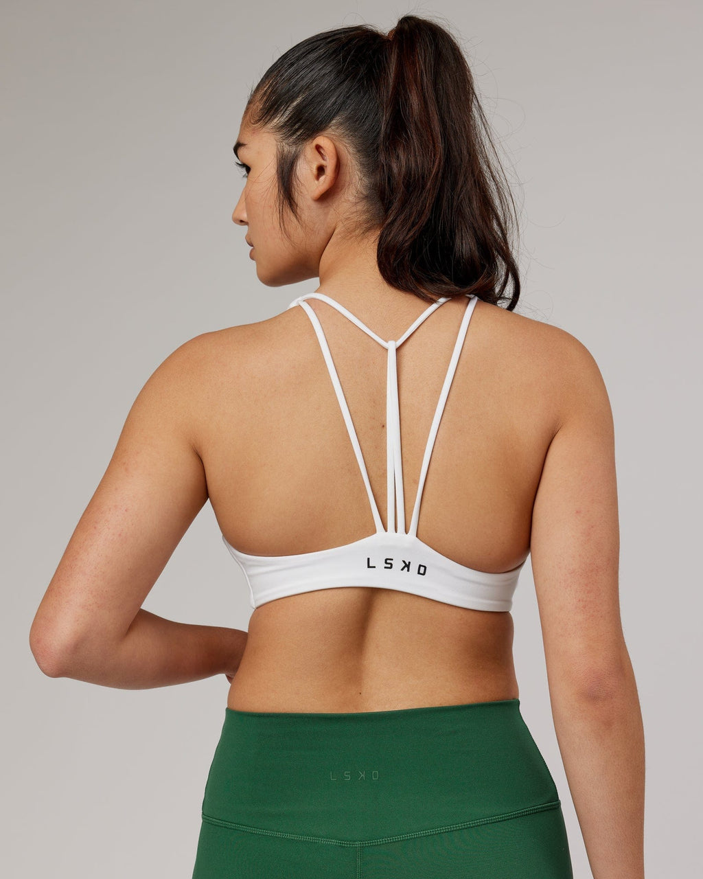Model wearing Agile Sports Bra - White