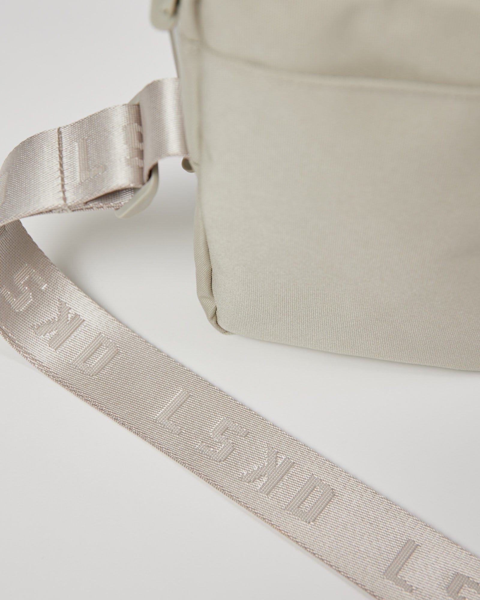 Model wearing All Day Cross Body Bag - Shale Beige