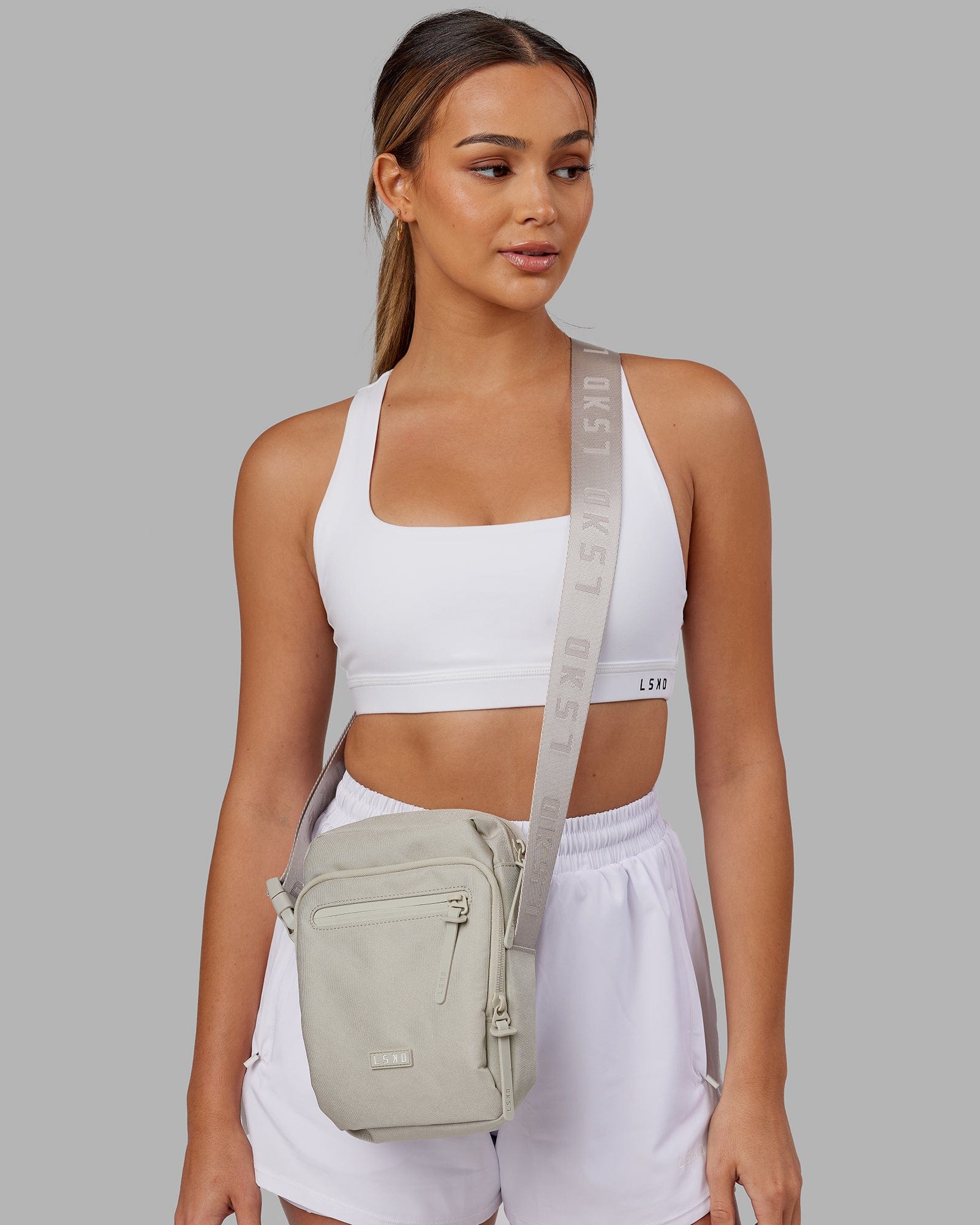 Model wearing All Day Cross Body Bag - Shale Beige