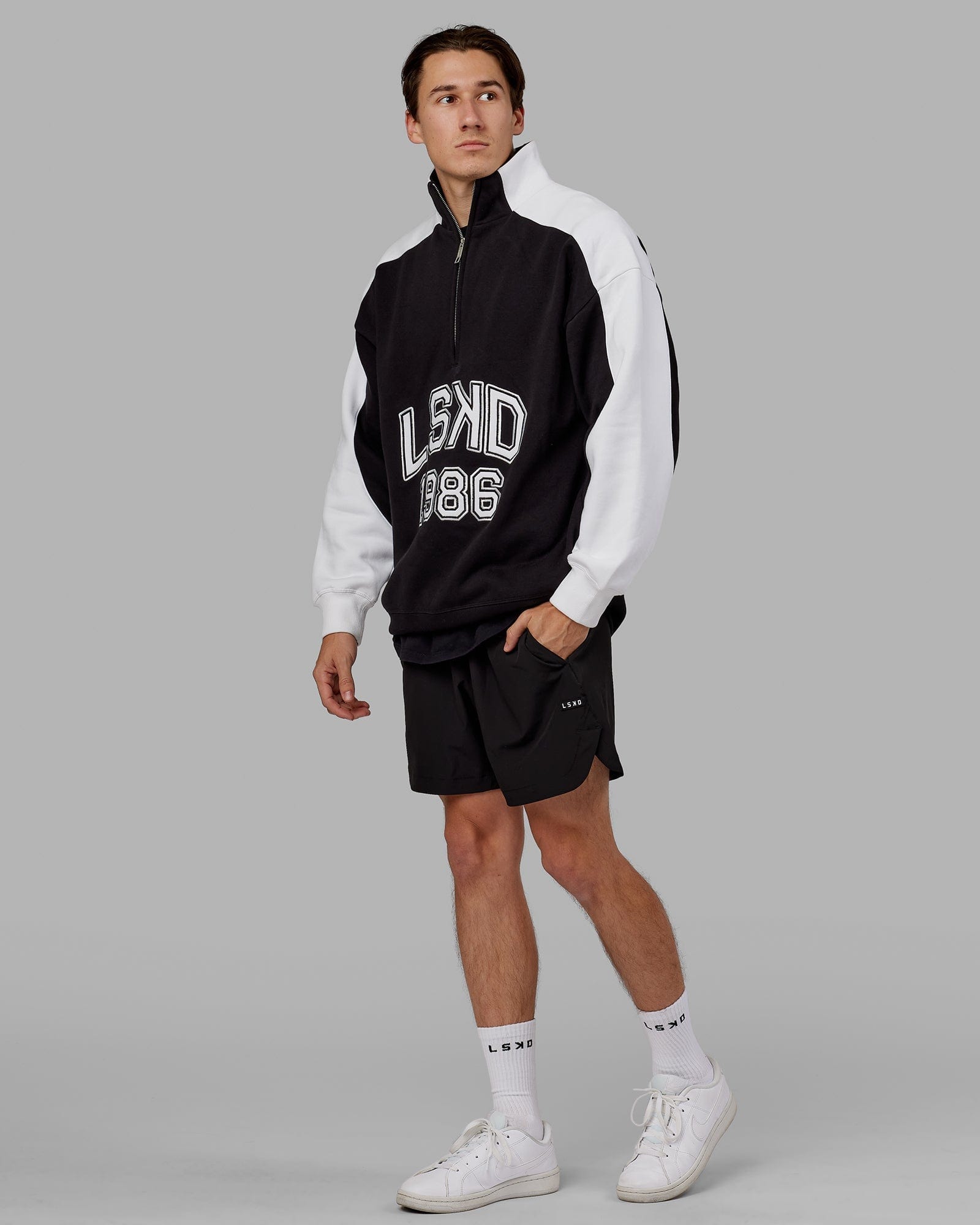 Model wearing Alumni 1/4 Zip Sweater Oversize - Black-White