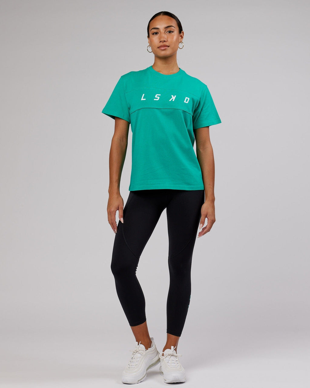 Model wearing Ascent Tee - Hyper Teal