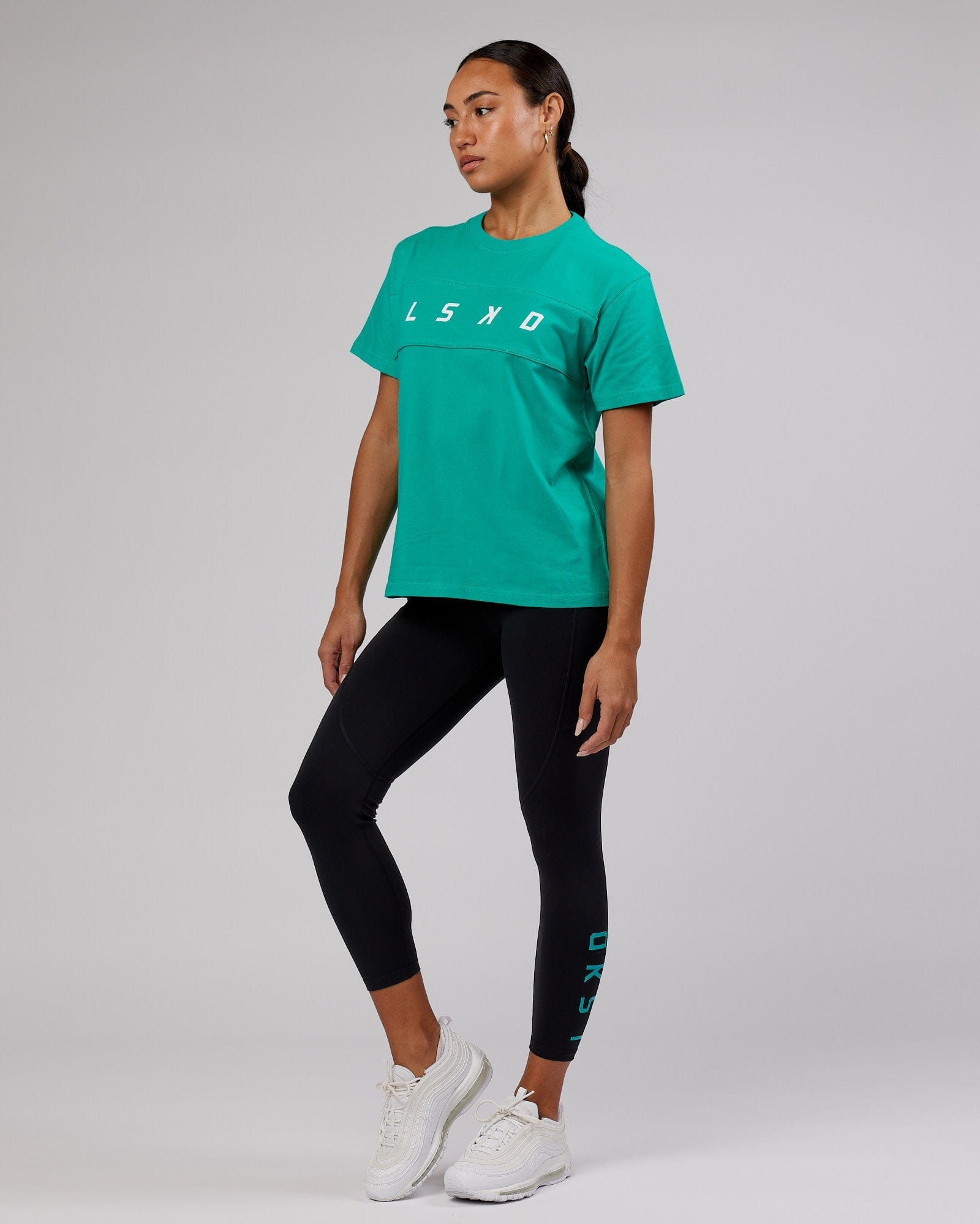 Model wearing Ascent Tee - Hyper Teal