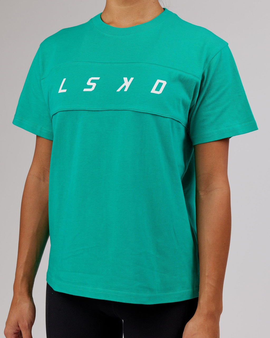 Model wearing Ascent Tee - Hyper Teal