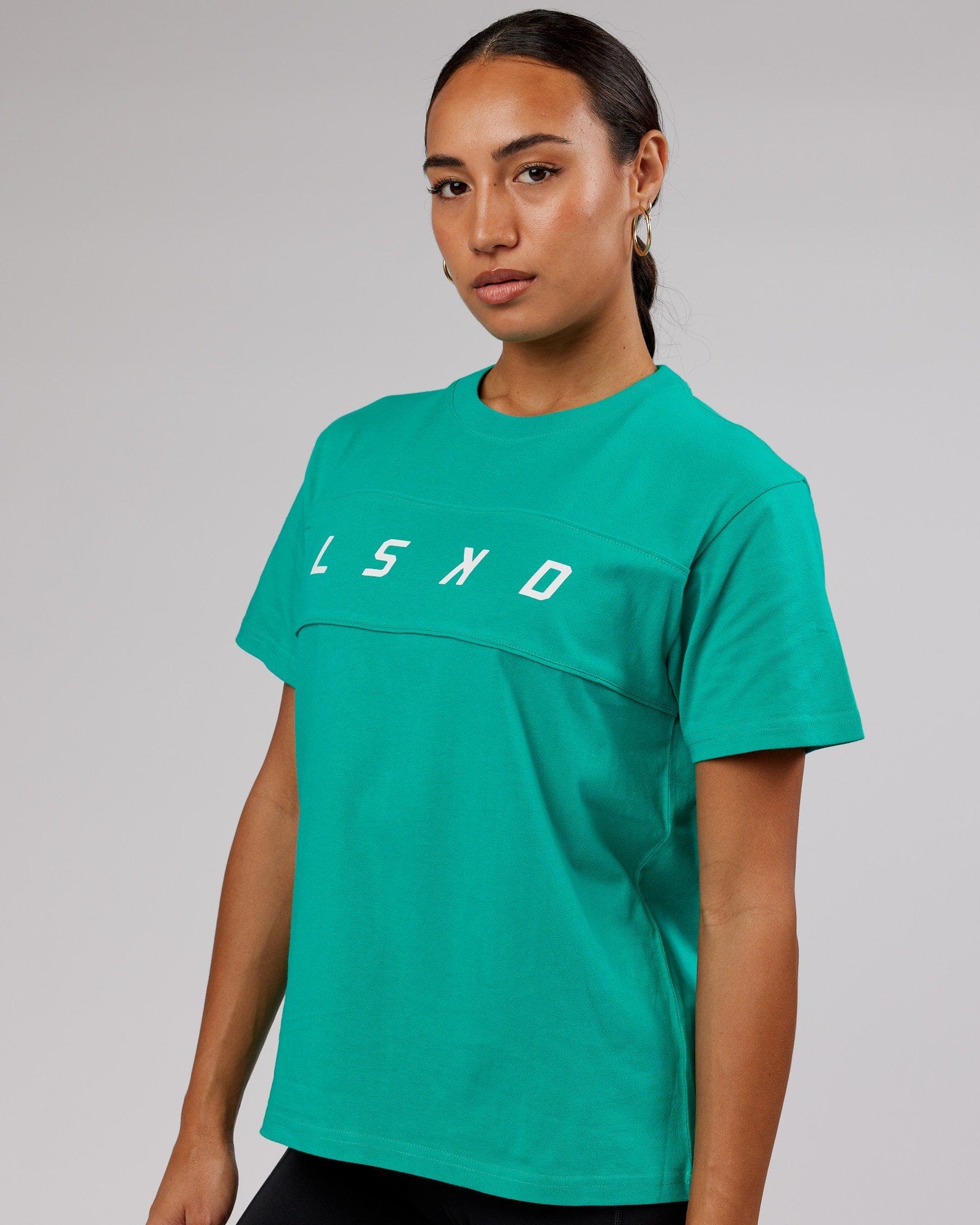 Model wearing Ascent Tee - Hyper Teal