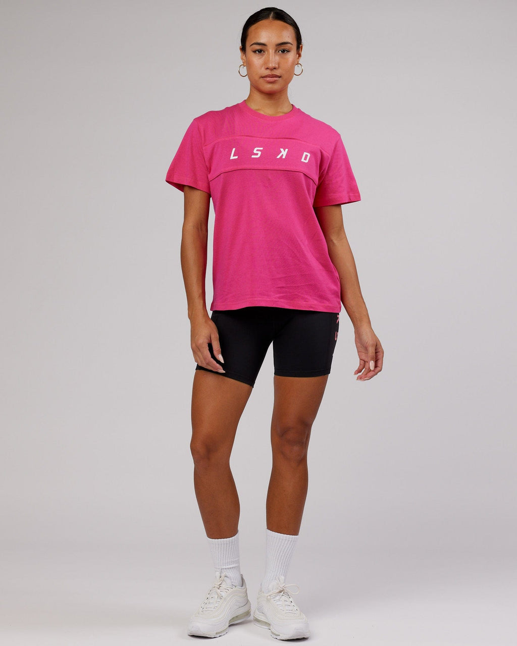 Model wearing Ascent Tee - Magenta