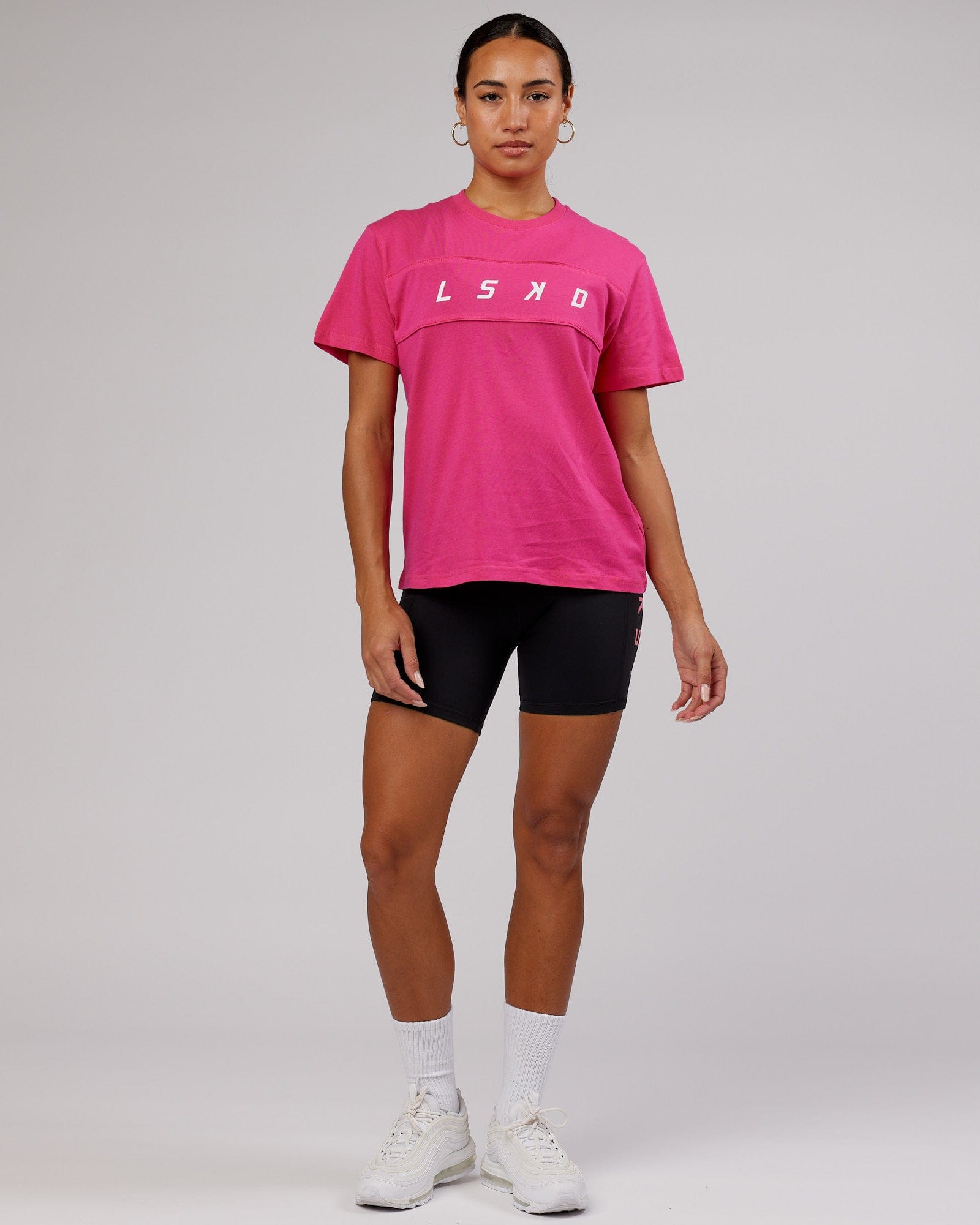 Model wearing Ascent Tee - Magenta