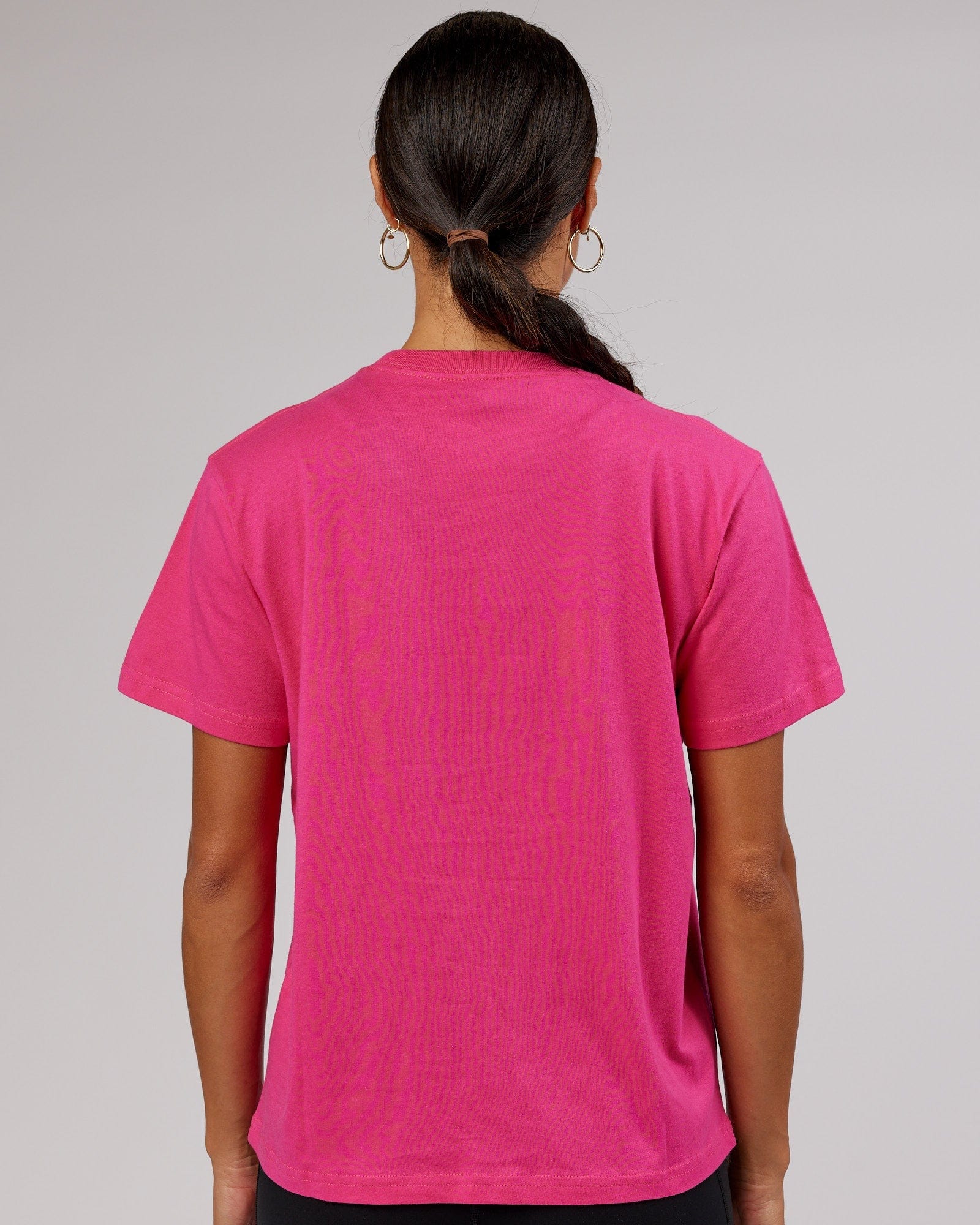 Model wearing Ascent Tee - Magenta