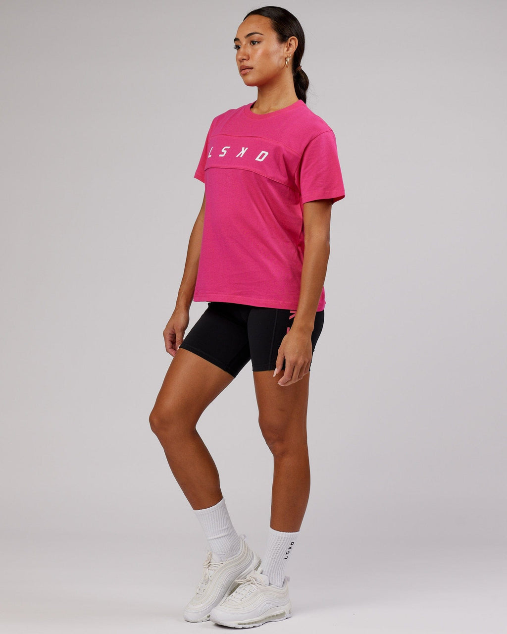 Model wearing Ascent Tee - Magenta