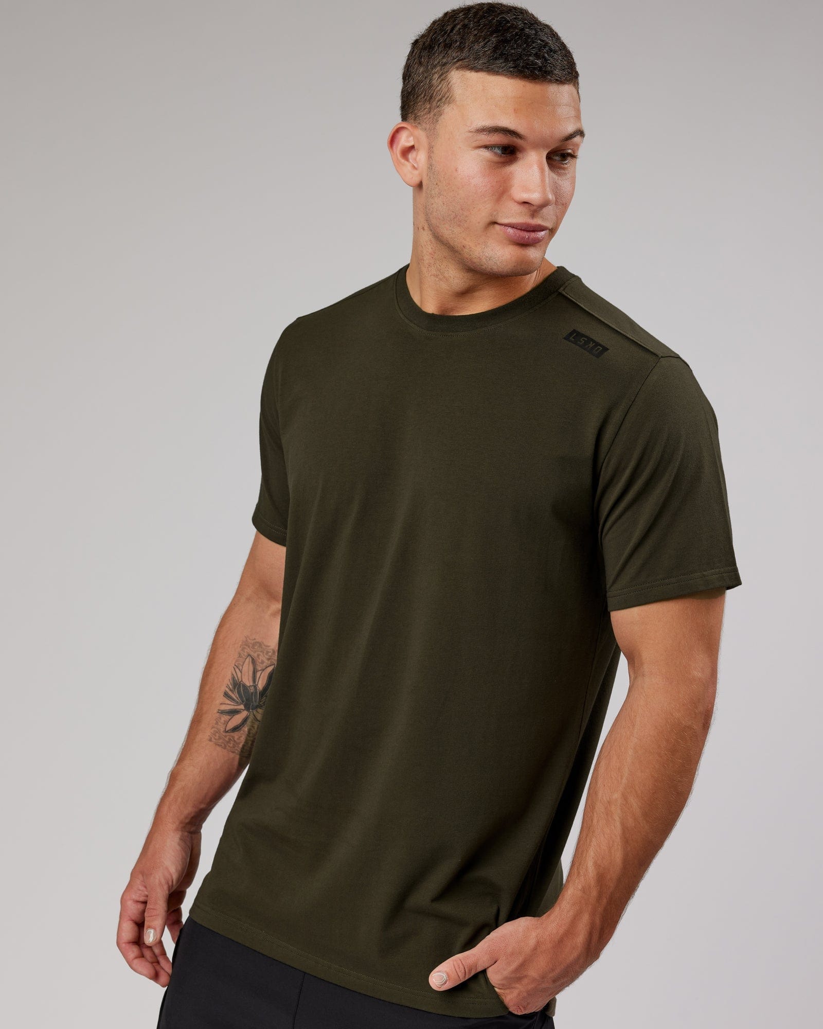 Model wearing Athlete FLXCotton Tee - Forest Night