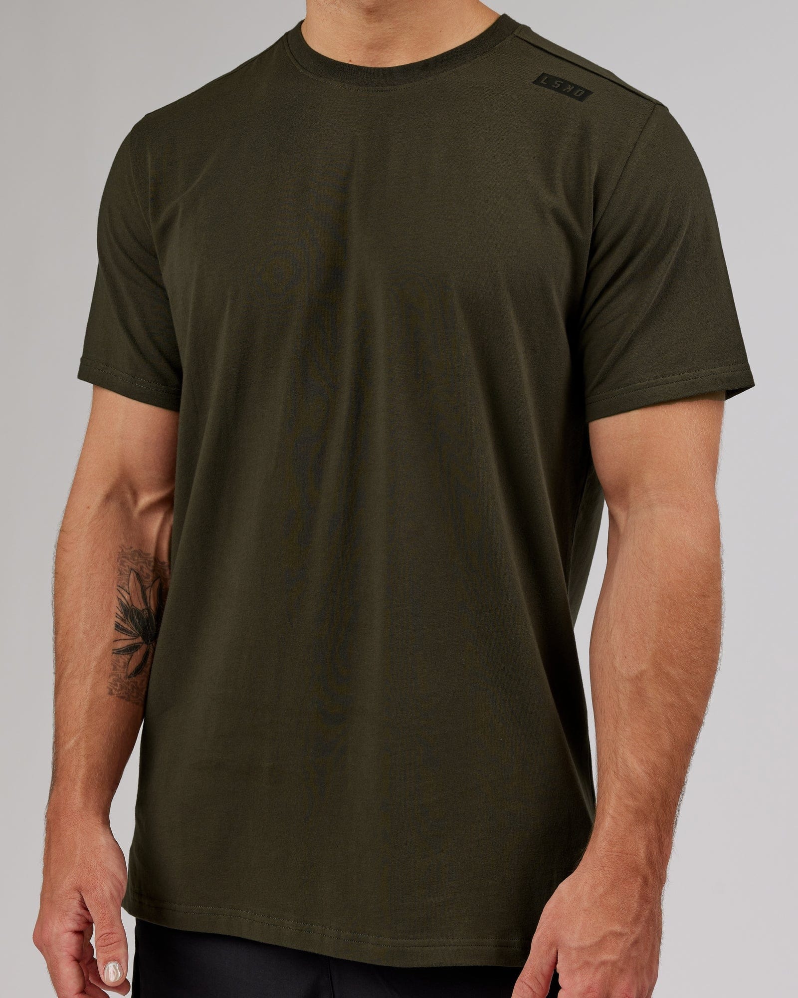 Model wearing Athlete FLXCotton Tee - Forest Night