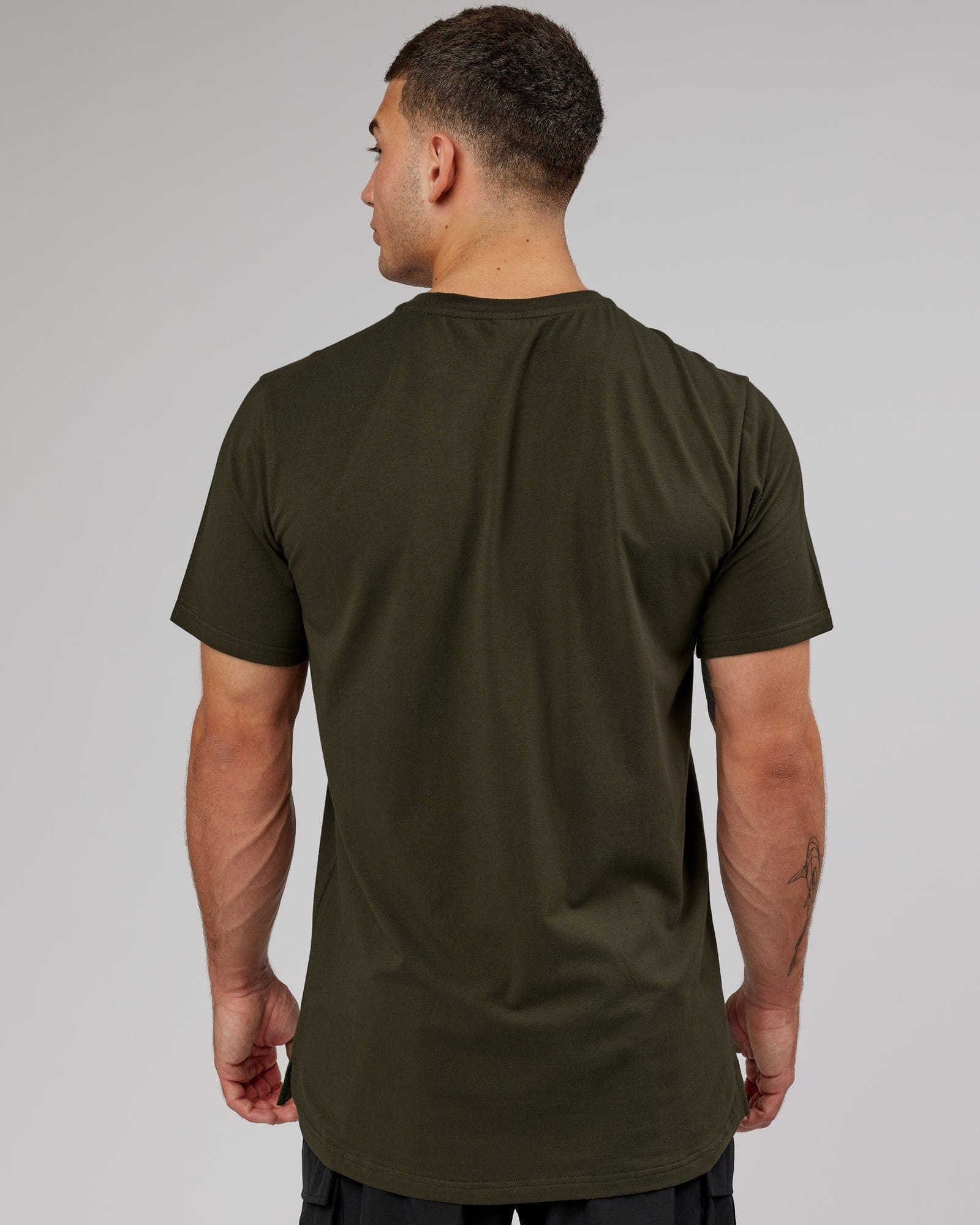 Model wearing Athlete FLXCotton Tee - Forest Night