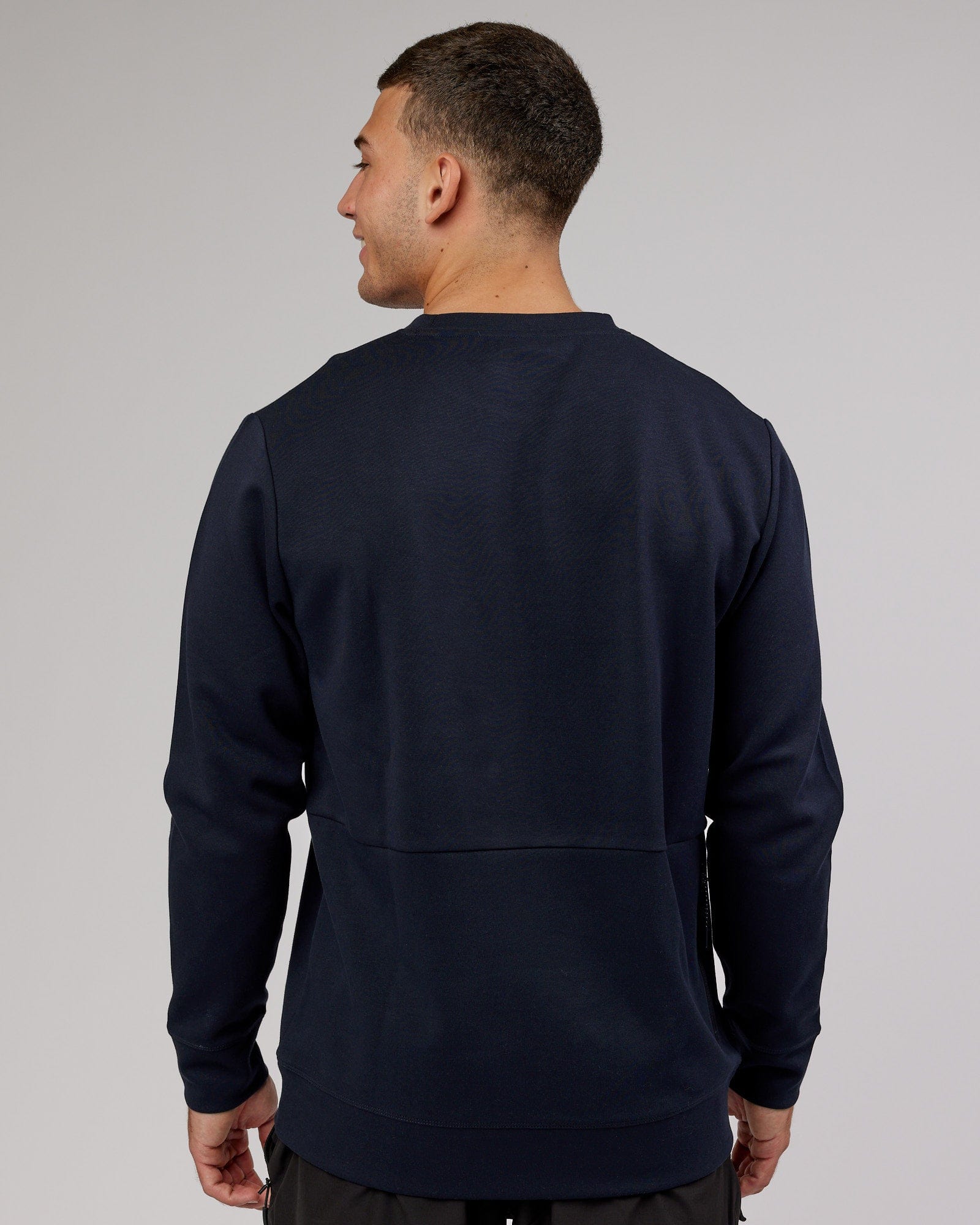 Model wearing Athlete ForgedFleece Sweater - Dark Navy