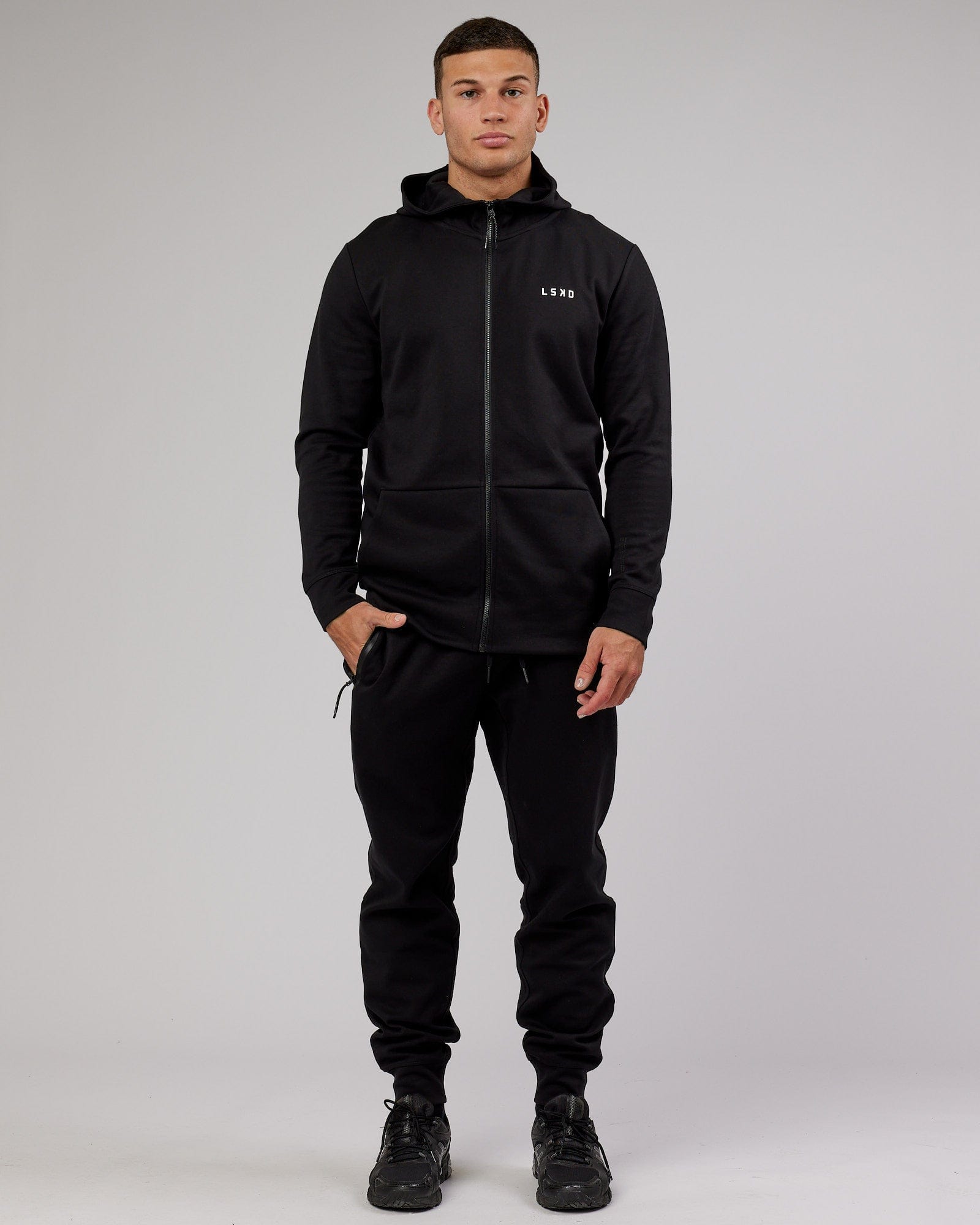 Model wearing Athlete ForgedFleece Zip Trackpant - Black