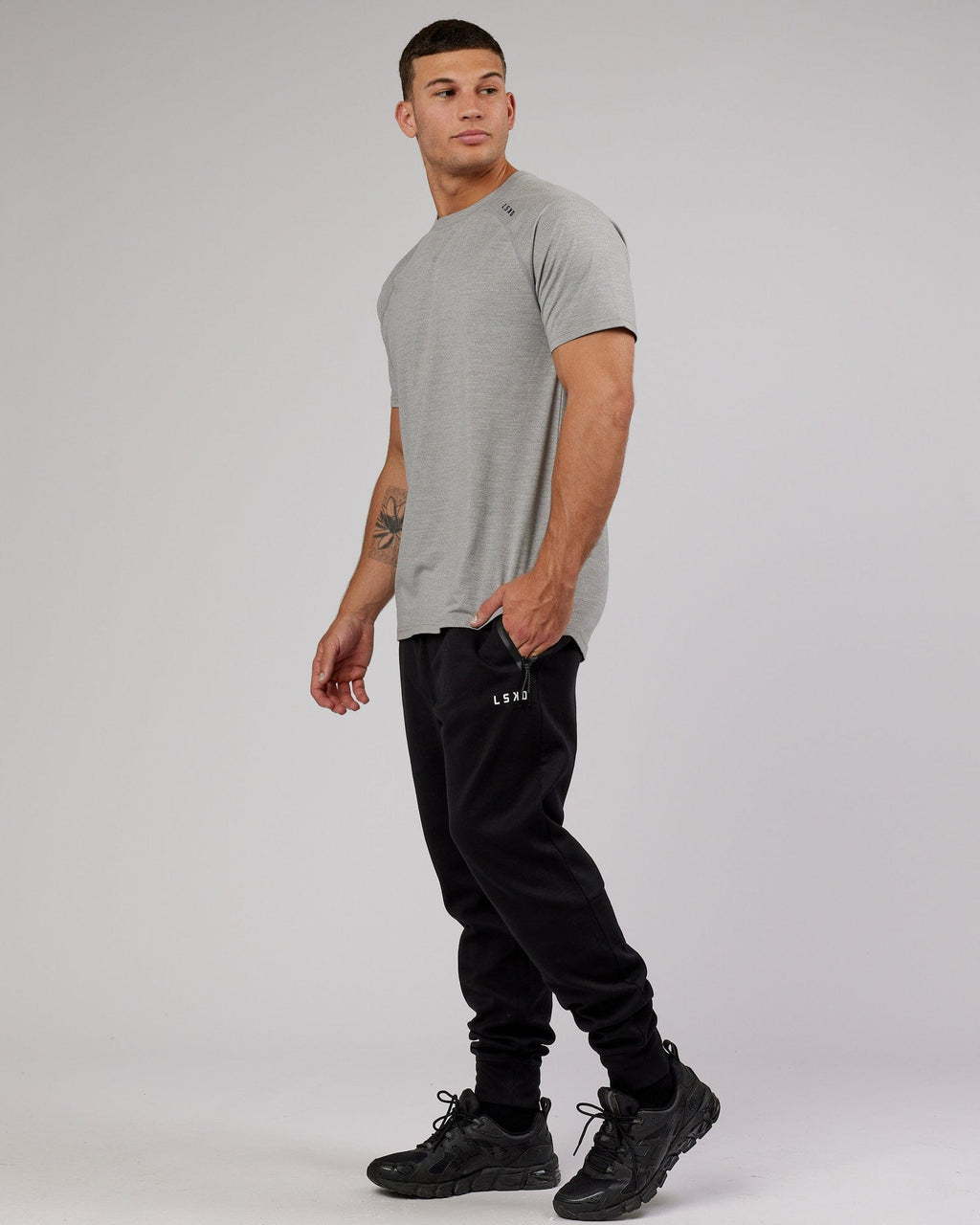 Model wearing Athlete ForgedFleece Zip Trackpant - Black