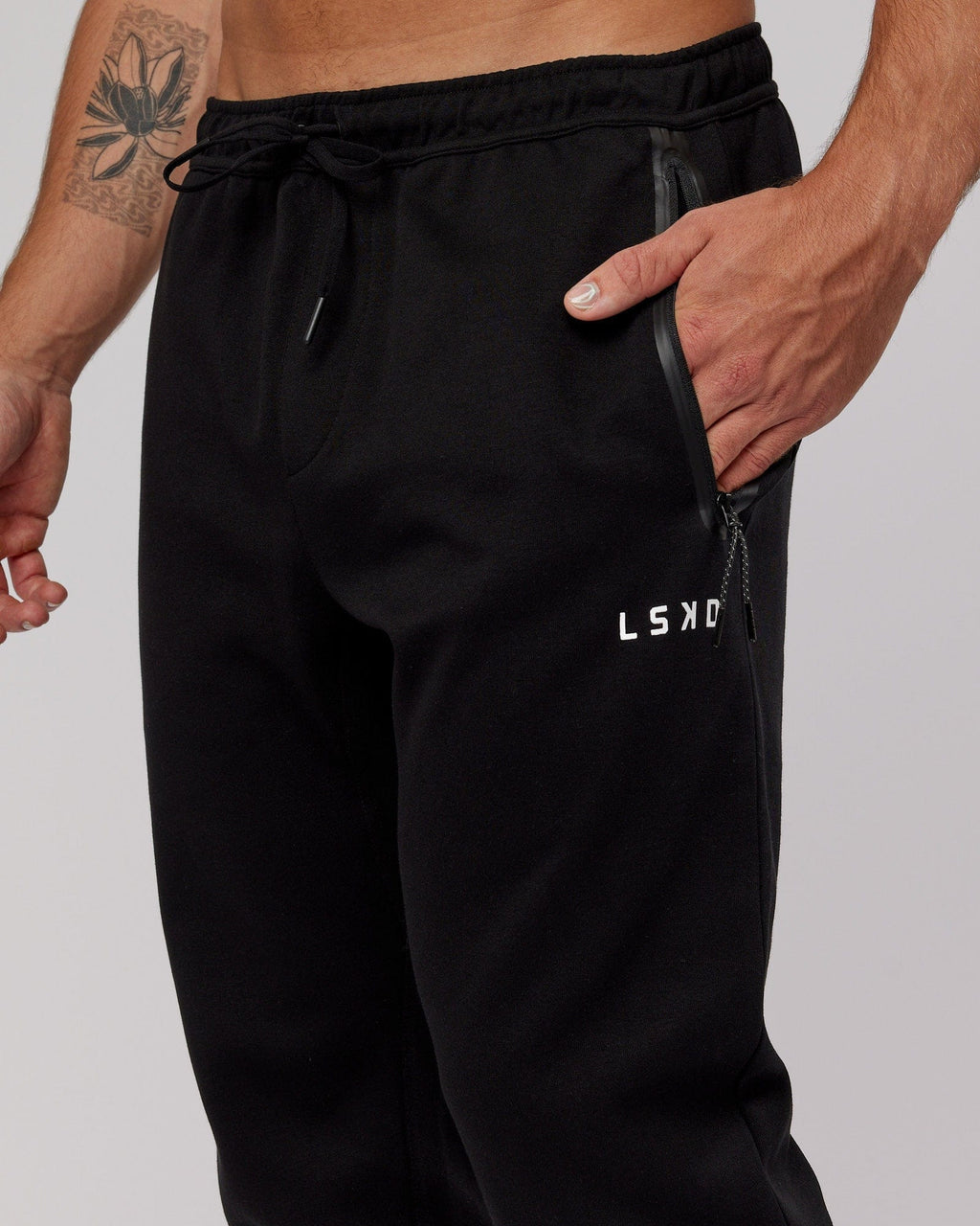 Model wearing Athlete ForgedFleece Zip Trackpant - Black