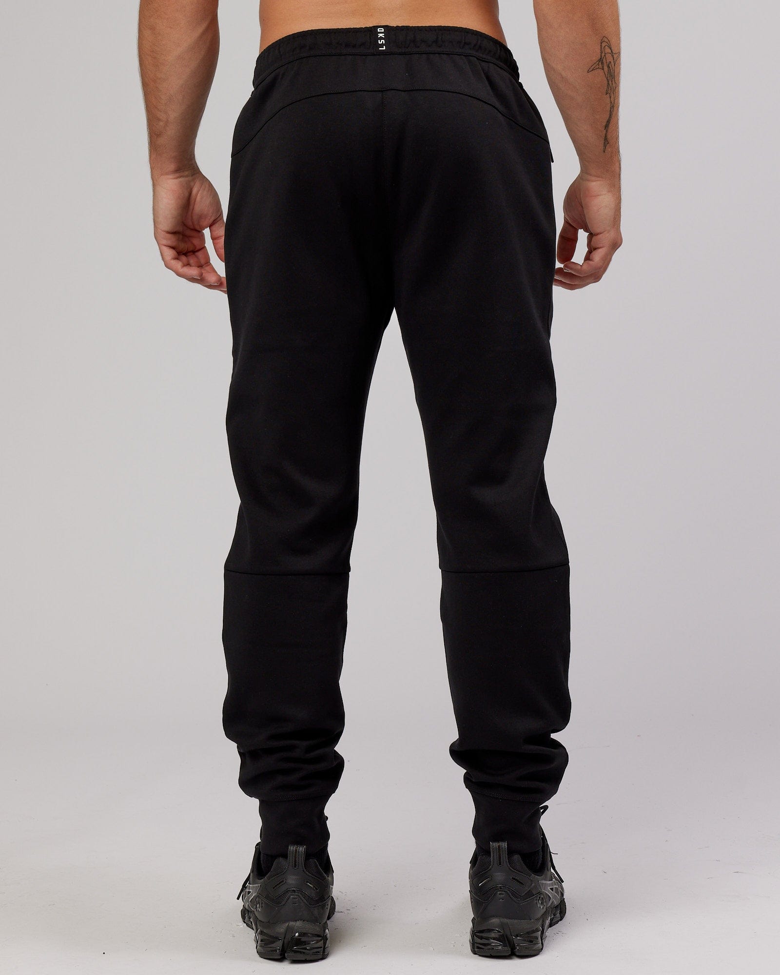 Model wearing Athlete ForgedFleece Zip Trackpant - Black