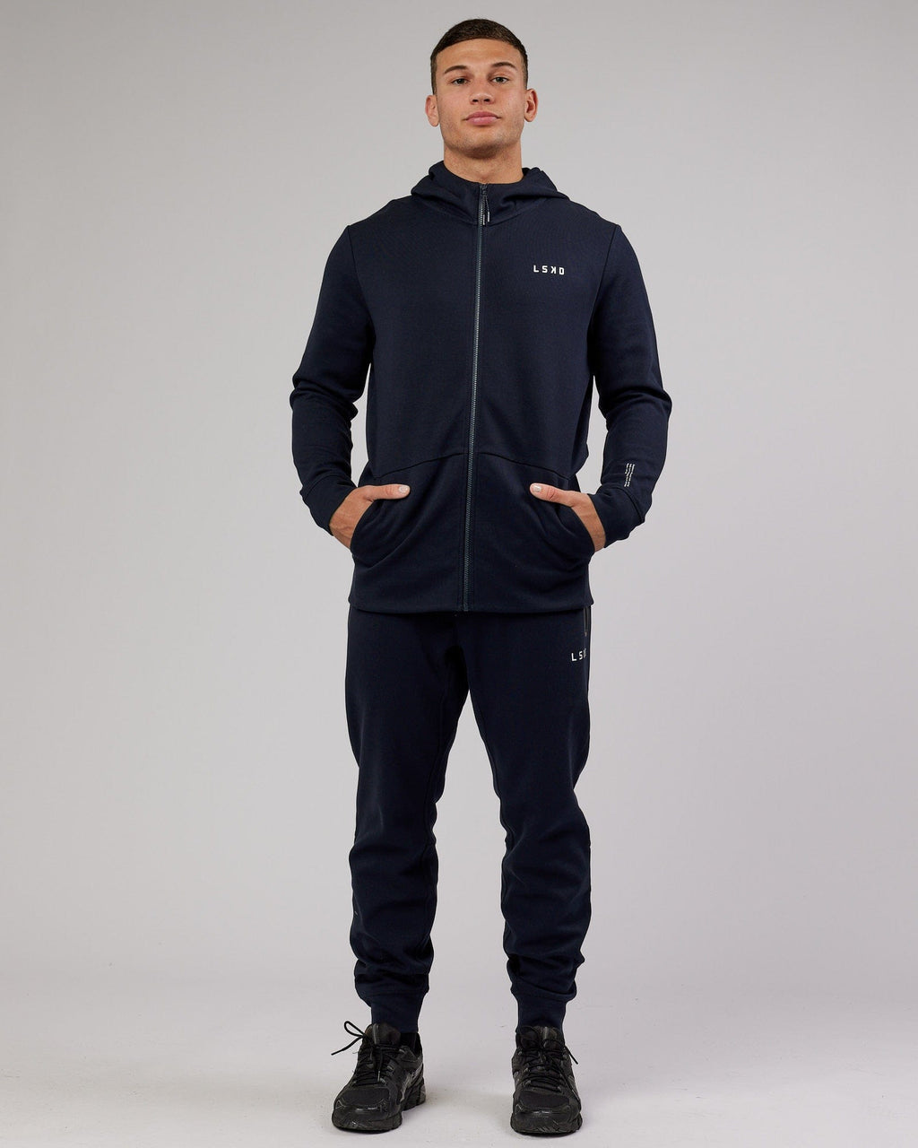 Model wearing Athlete ForgedFleece Zip Trackpant - Dark Navy