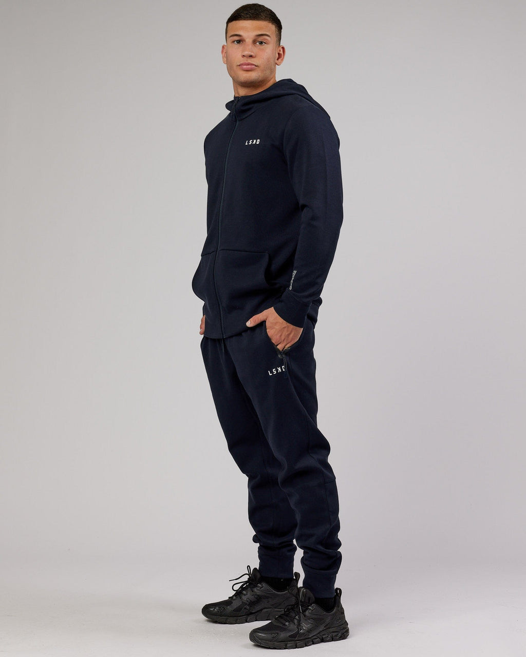 Model wearing Athlete ForgedFleece Zip Trackpant - Dark Navy