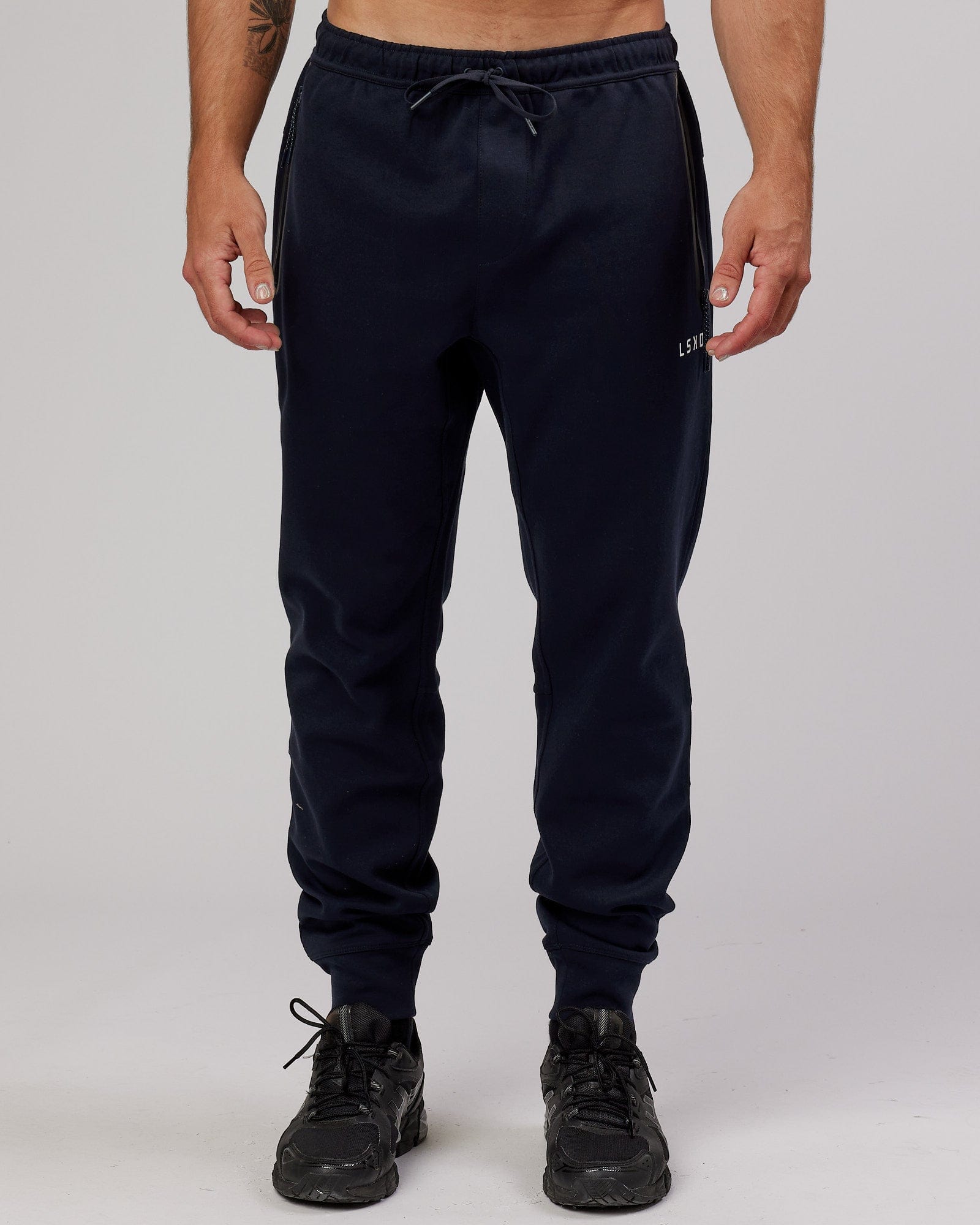 Model wearing Athlete ForgedFleece Zip Trackpant - Dark Navy