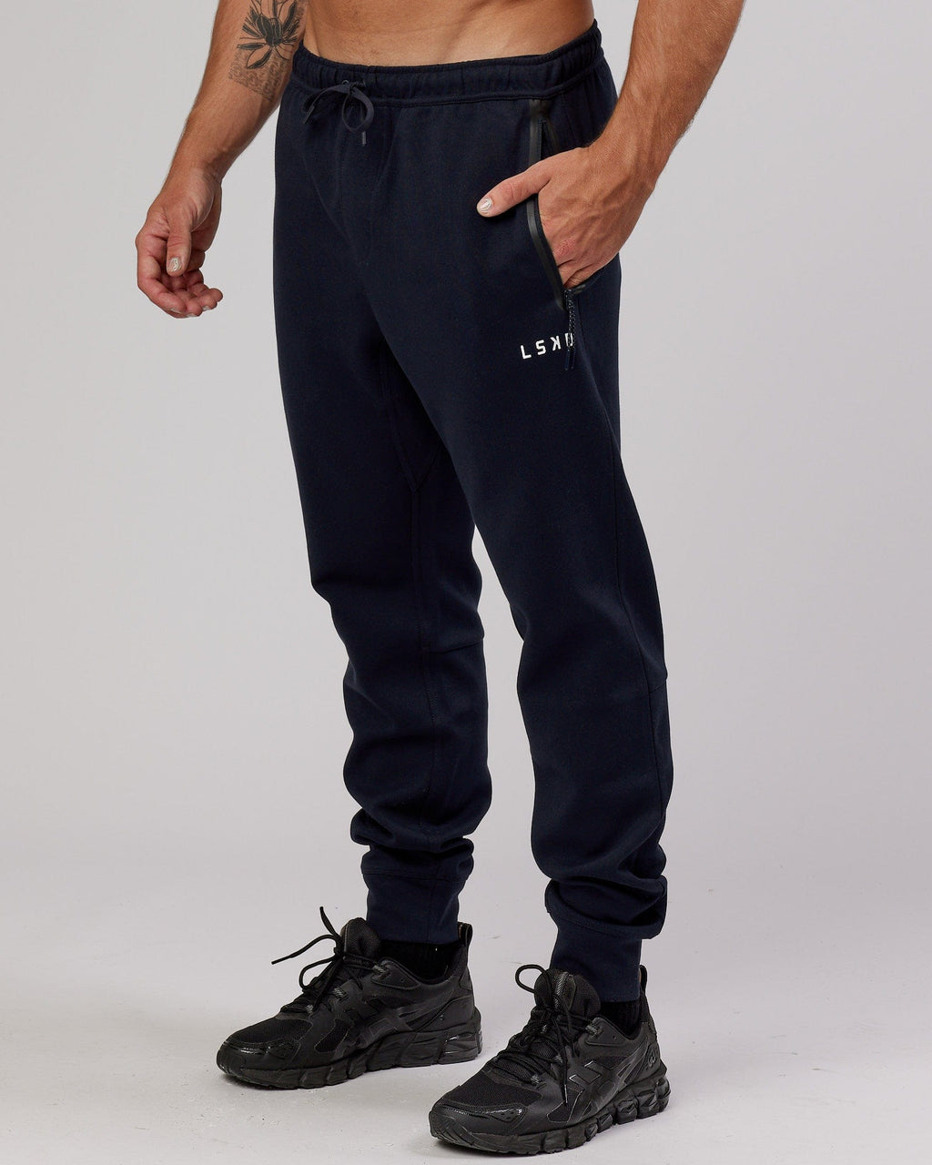 Model wearing Athlete ForgedFleece Zip Trackpant - Dark Navy