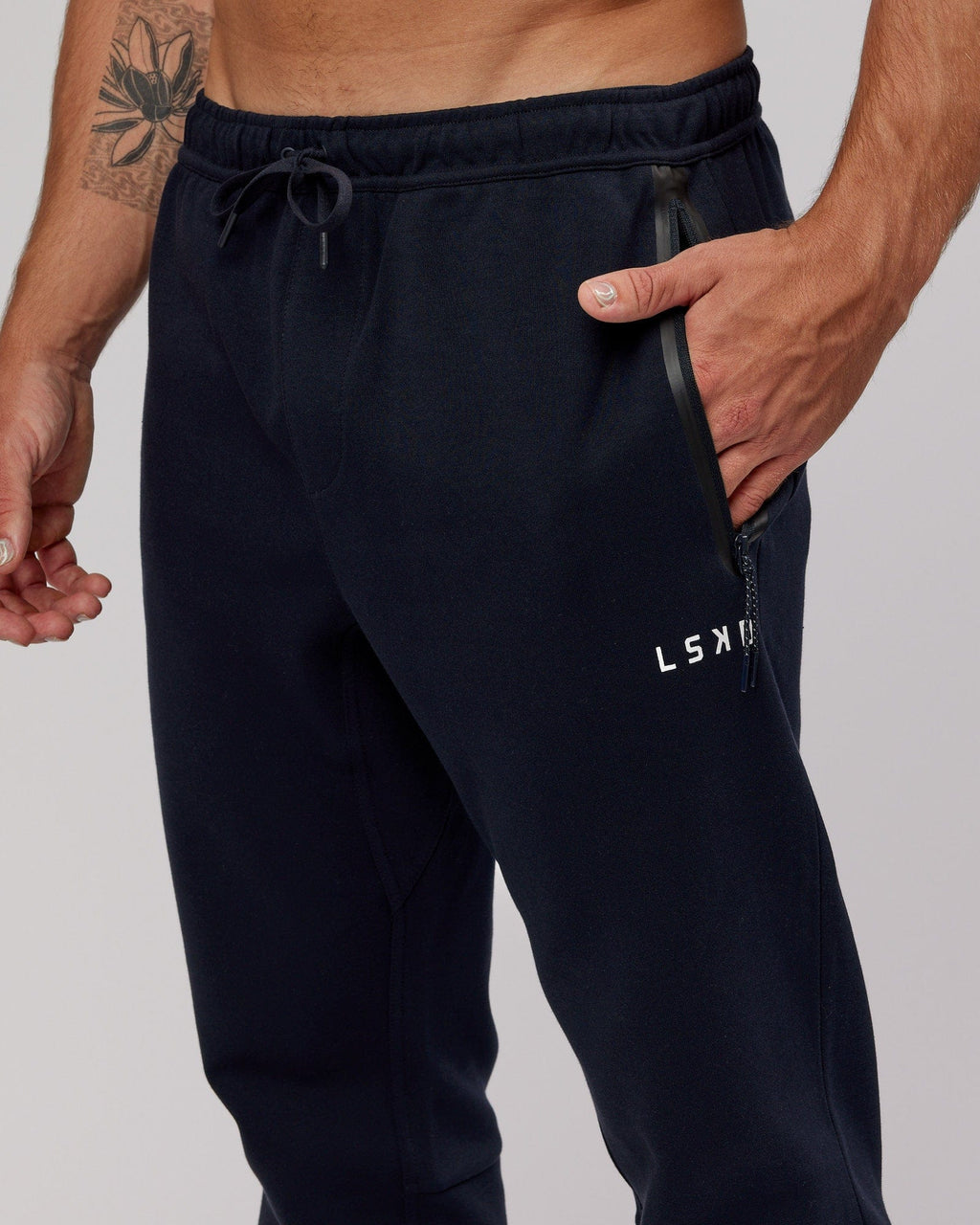 Model wearing Athlete ForgedFleece Zip Trackpant - Dark Navy