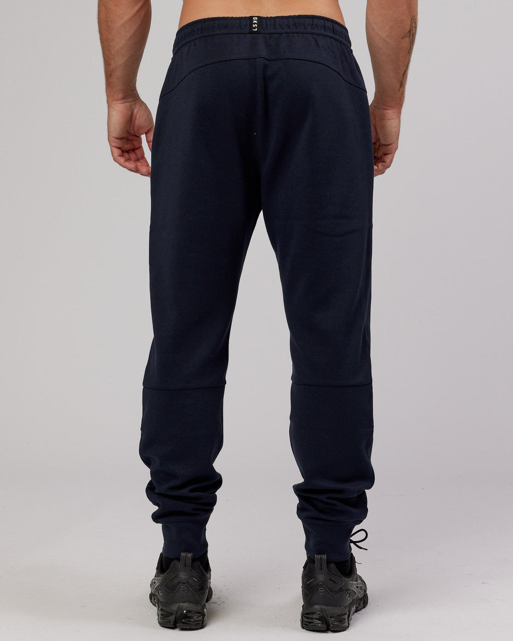 Model wearing Athlete ForgedFleece Zip Trackpant - Dark Navy